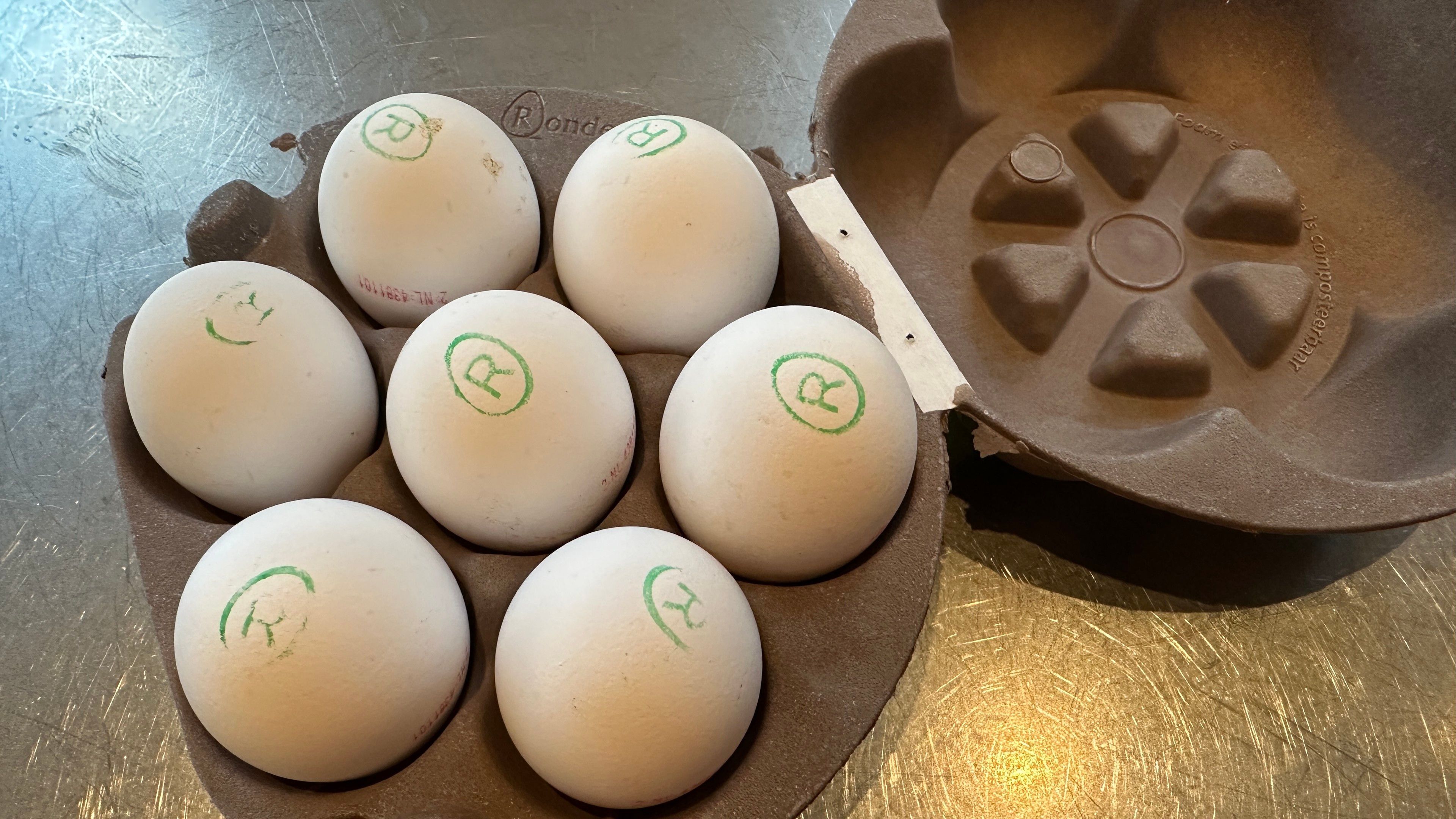 Egg carton with seven eggs in a hexagonal packing. 