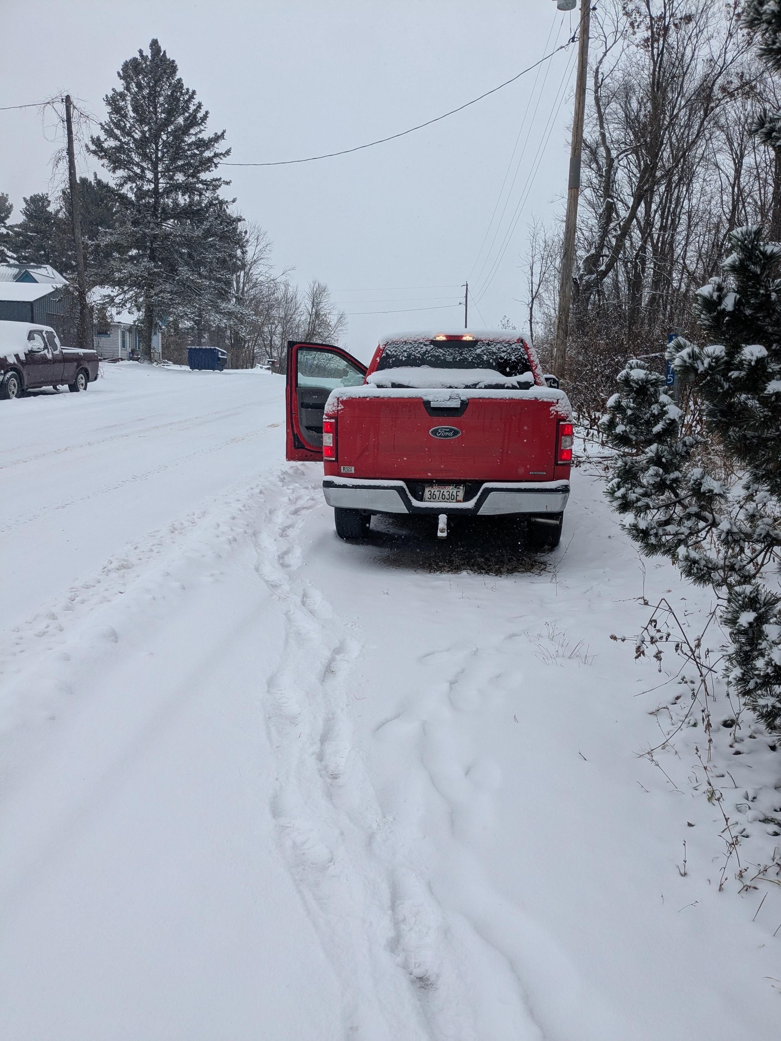 A red truck in the snow 