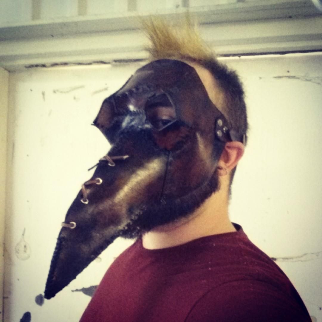 Selfie. Wearing a leather plague mask with a long, laced-up beak. 