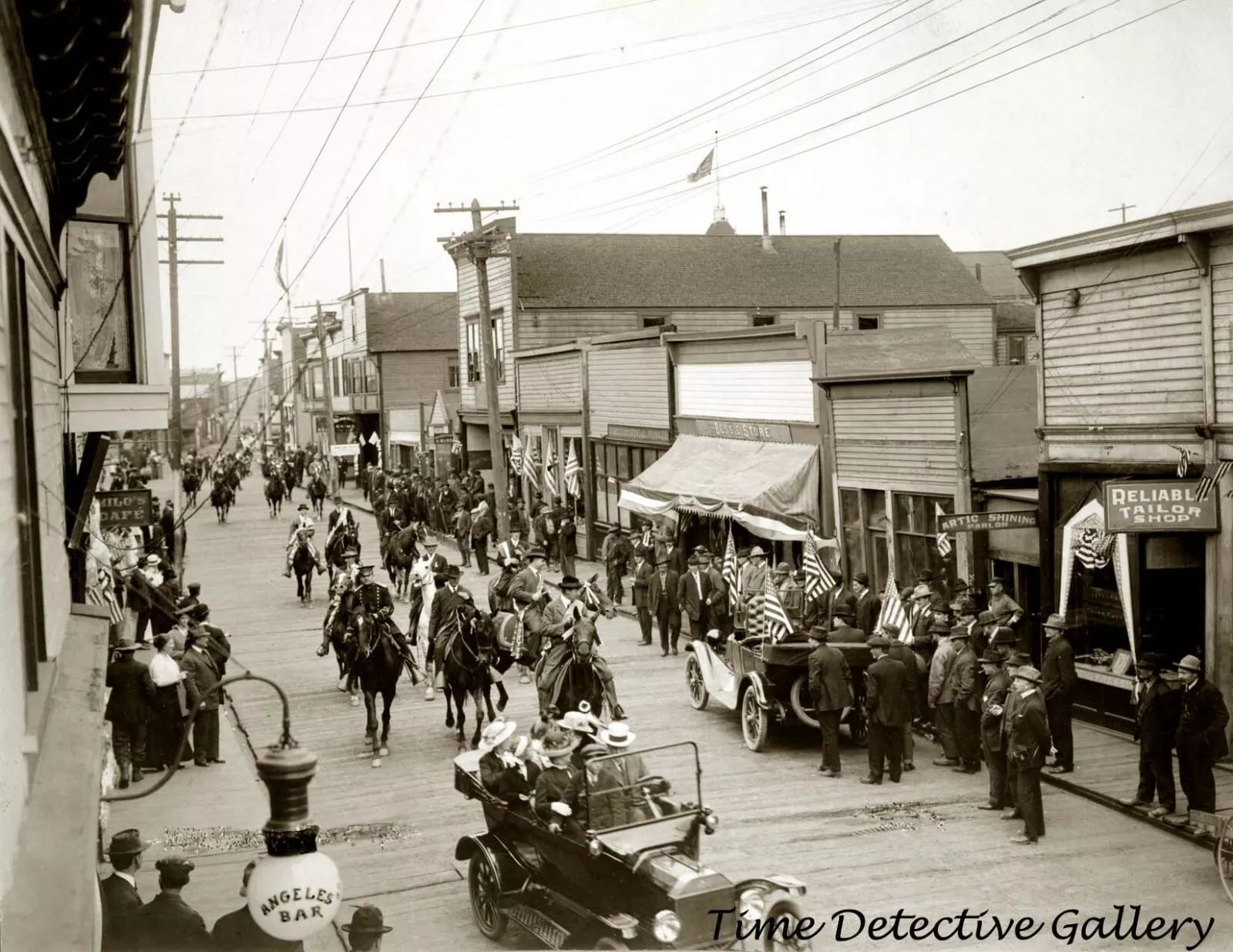 1916 Nome parade street scene, unusually showing two excellent photos of cars ... but a man is standing in front of the back bumper of one, and the other's front bumper is juuuuuuust out of shot.