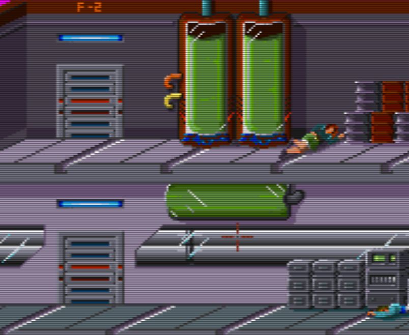 Room 20: this is a screenshot that show a section of the room 20. It's on two levels, in the upper level there are a couple of big glass containers with a green fluid in them, on the floor there is a woman fainted.
In the lower level there are tubes behind a glass window, some drawers and an horizontal glass container with green fluid in it.
On the far eight there is a man fainted on the floor.
On both levels there are two doors.