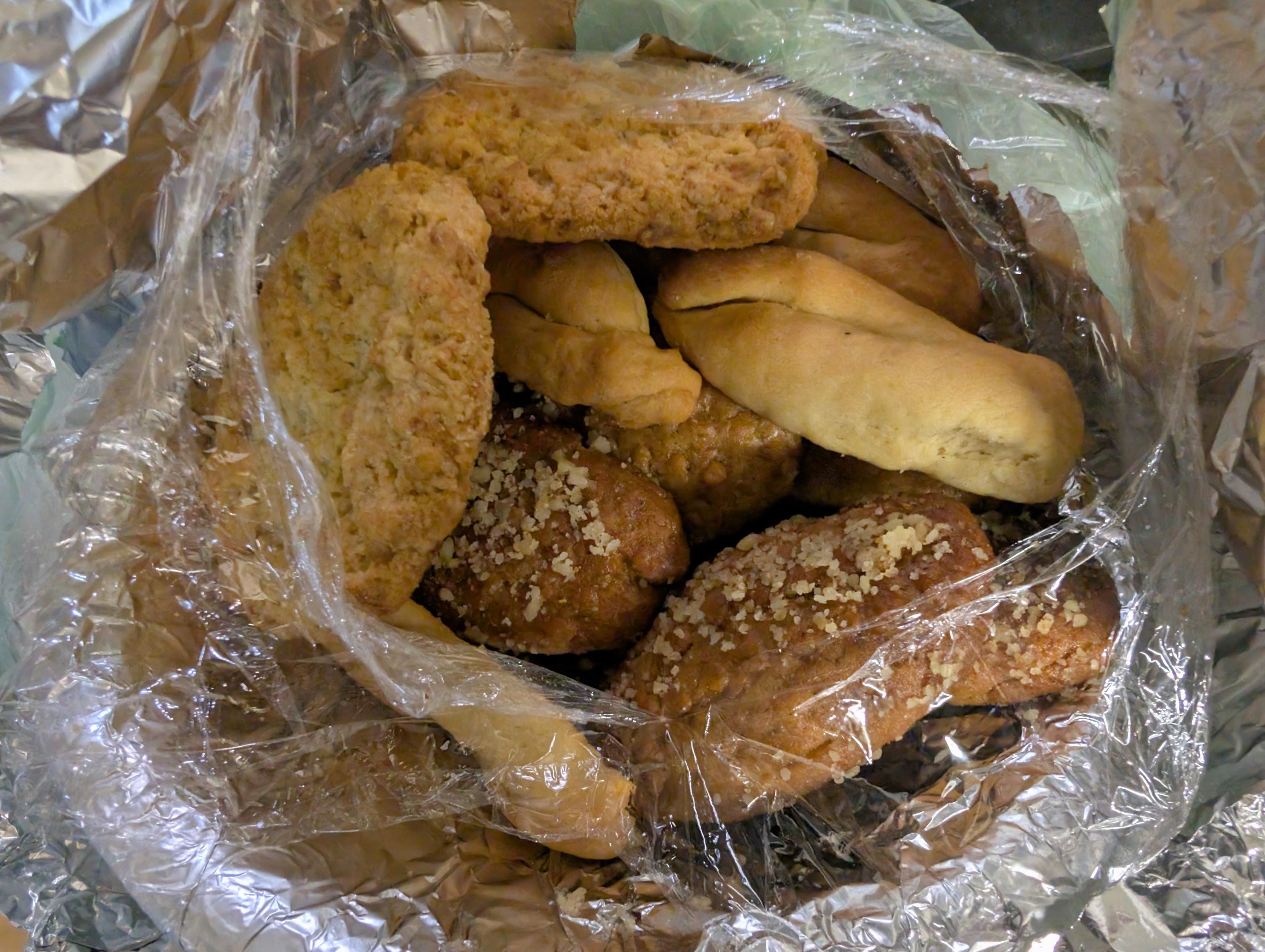 Sitting in a foil covered paper bowl a large number of cookies, all my favourites too if I knew the name I would let you know ... Hugz