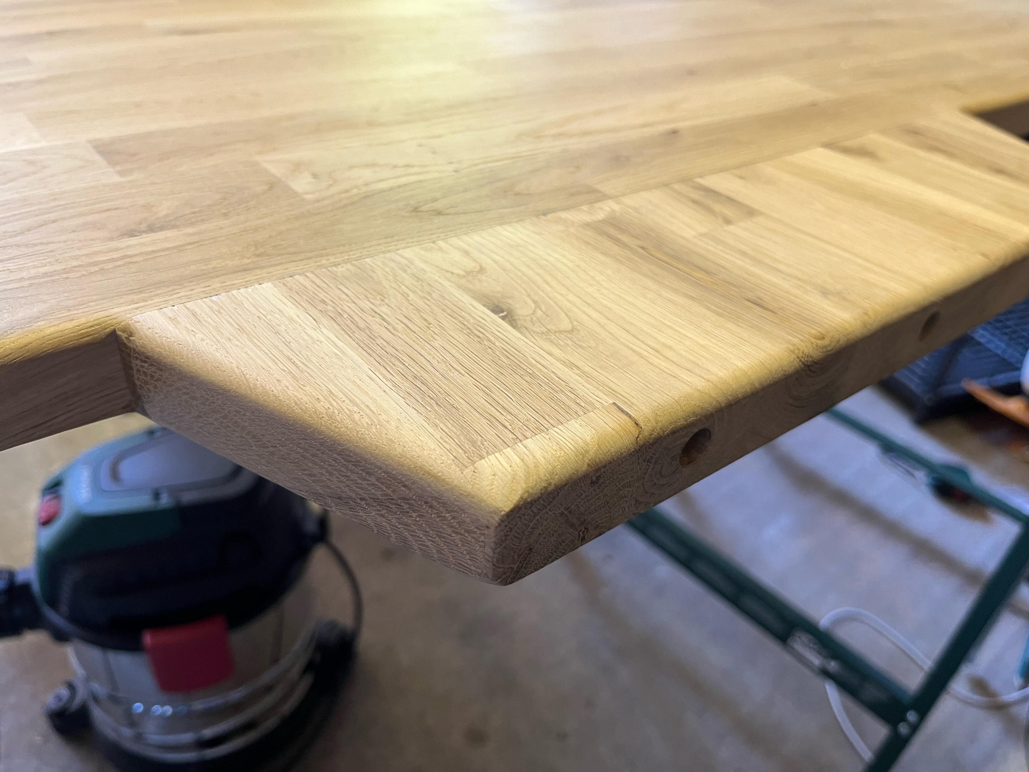 Monitor stand outrider on back of worktop