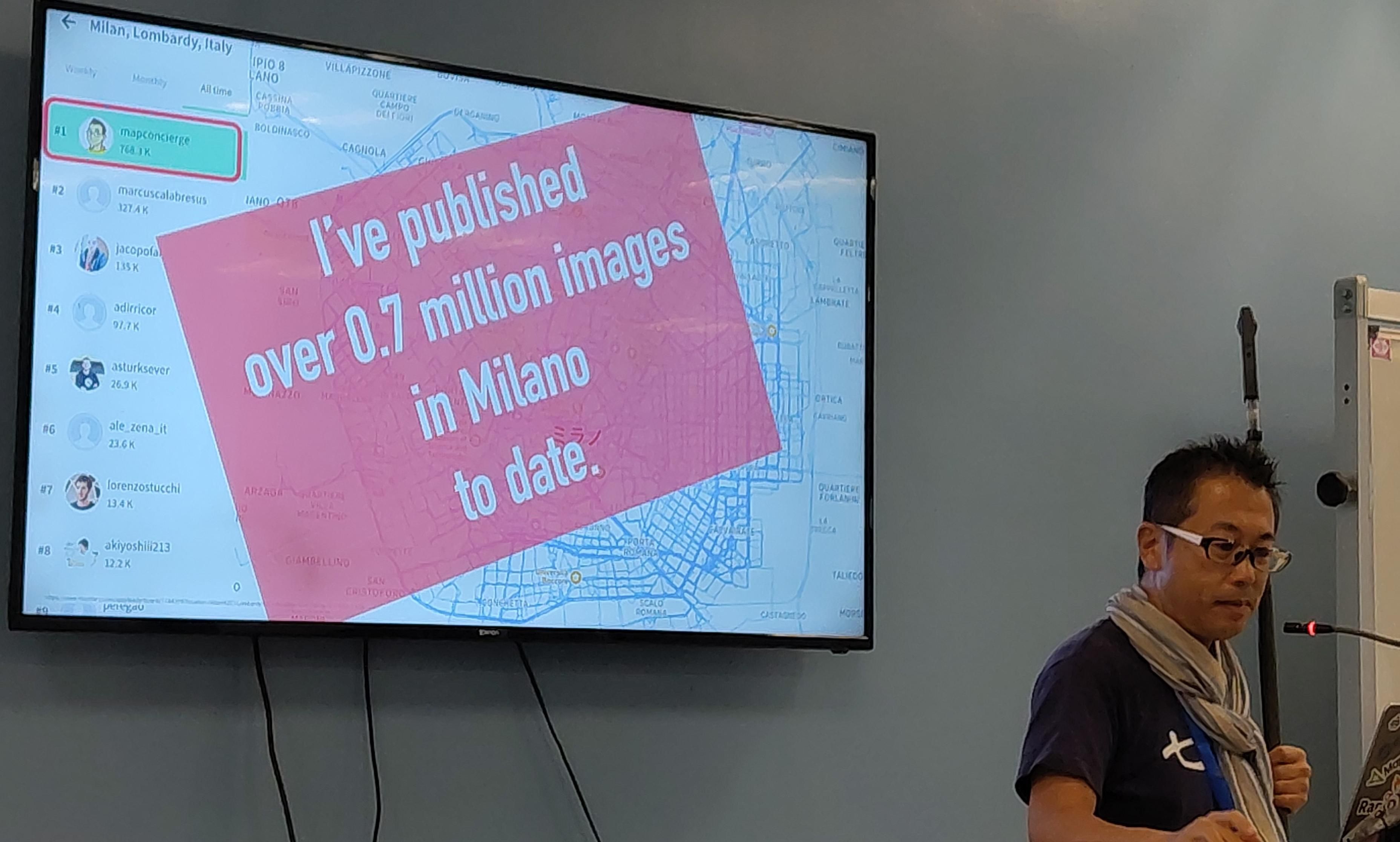 Tahichi Furuhashi con una slide "I've published over 0.7 million images in Milano to date"