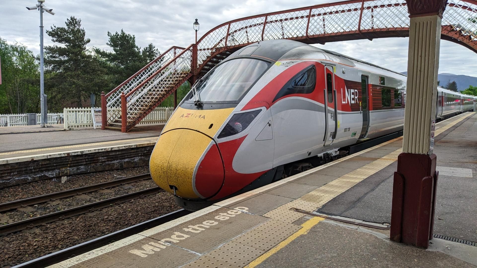 LNER Azuma at Aviemore with steel footbridge