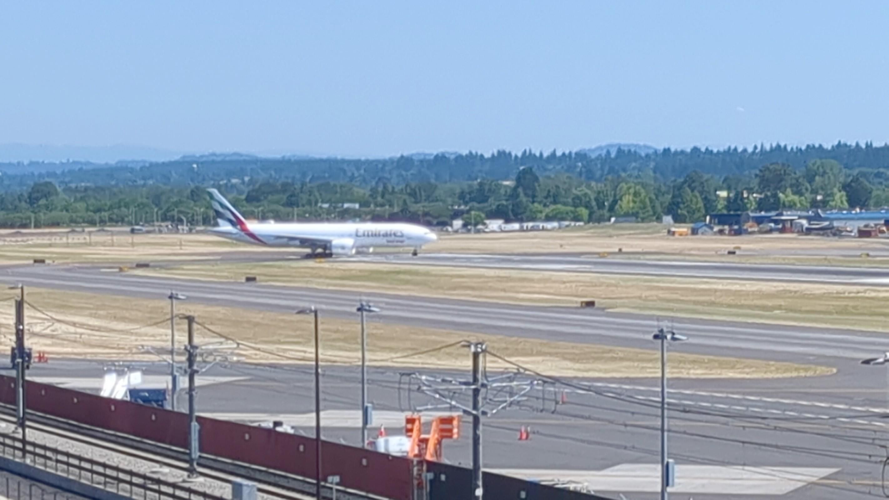 A new Boeing 777-200LR/F freighter taxiing from the Boeing Portland Paint Hangar at Portland Int'l Airport PDX for departure to Boeing Field BFI in Seattle where the customer will complete the purchase and take delivery of the plane.
photo by Ian Kluft
July 24, 2025
Portland, Oregon, USA
