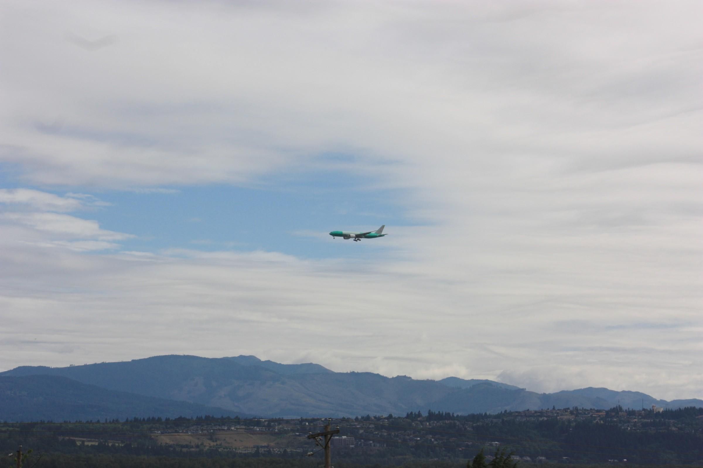 new unpainted green Boeing 777-200LR freighter on final approach to Portland Int'l Airport KPDX
photo by Ian Kluft
July 10, 2025
Portland, Oregon, USA