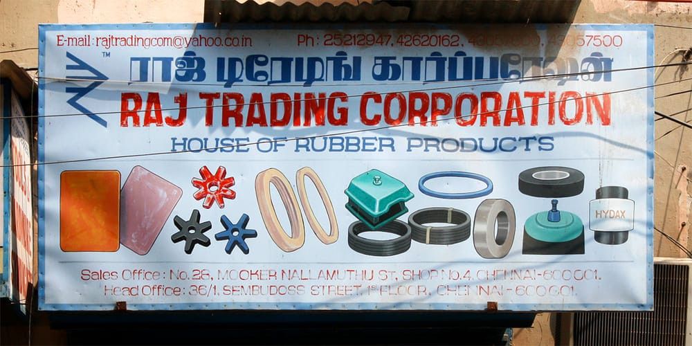 Tamil and Latin sign by an unknown painter for Raj Trading Corporation in Chennai, which eschews visually matching the two scripts.