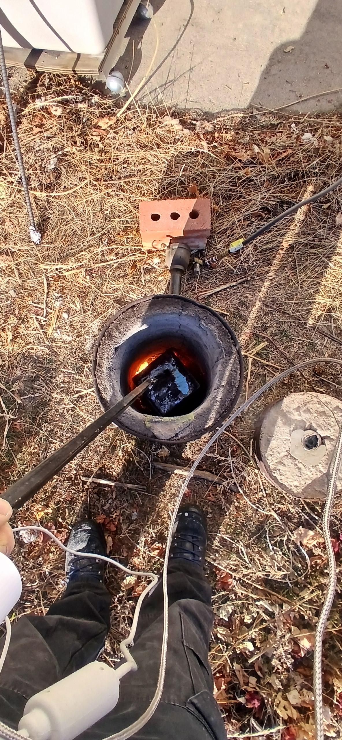 Down in hell with a big gob of molten aluminum and the temp gauge down in the crucible 