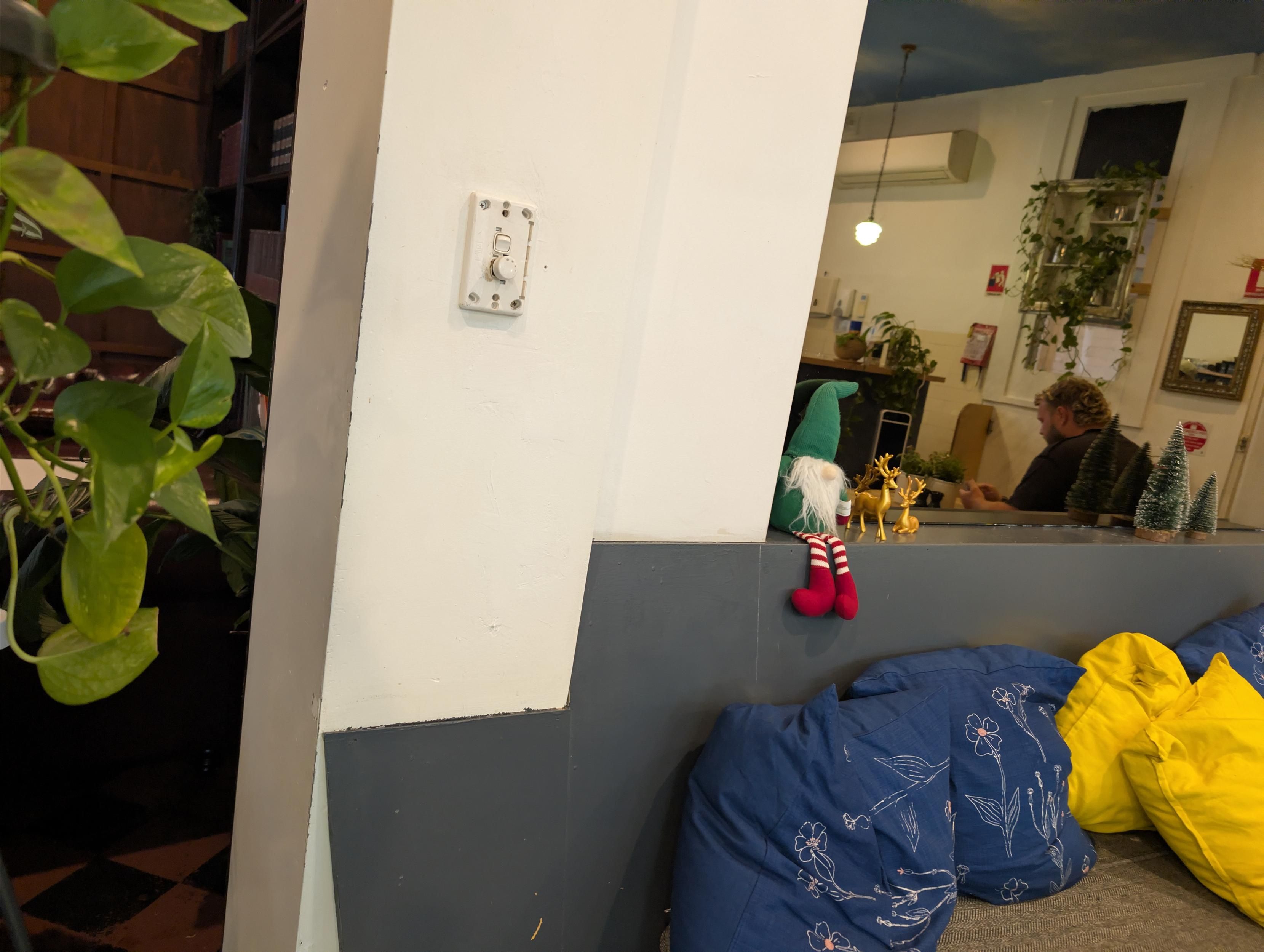 Elf on a shelf on the back of the booth