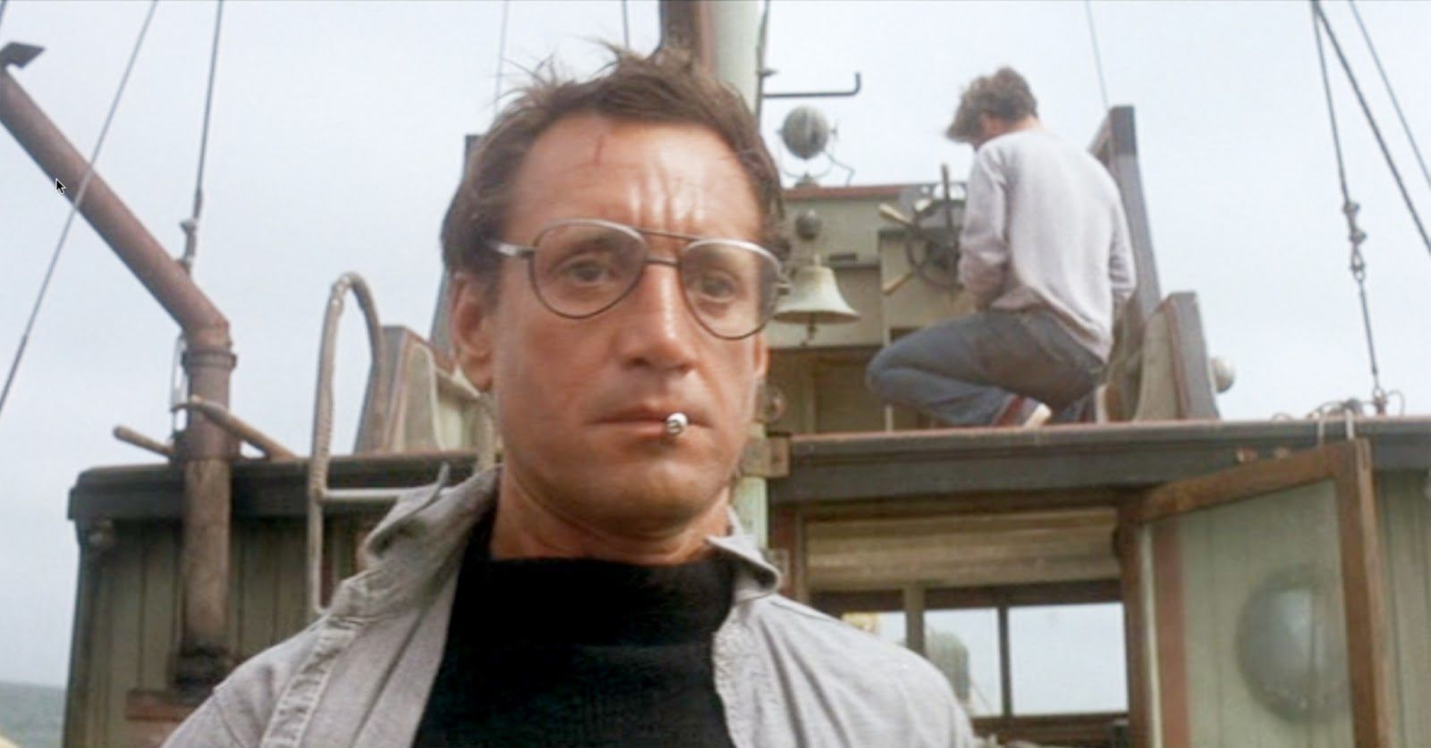 Roy Scheider as Chief Brodie in the movie “Jaws“, just after seeing the shark up close, and just before saying the line “You‘re gonna need a bigger boat.“ Richard Dreyfus as Matt Hooper in the background with his back turned.