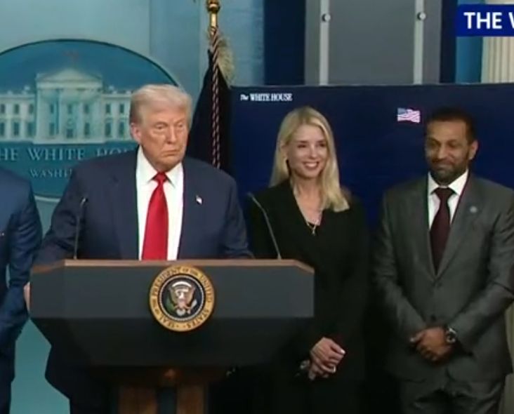 A screen cap of Trump's DC presser, showing Pam Bondi, Kash Patel, and Trump. 