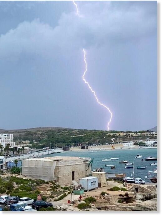 The image is of Għadira Bay, Mellieha Malta during a late summer morning thunder storm, where a bolt of  lightning was photographed as it hit the ground. The image was taken on 13th Sep 2020 by 'Lovin Malta'
