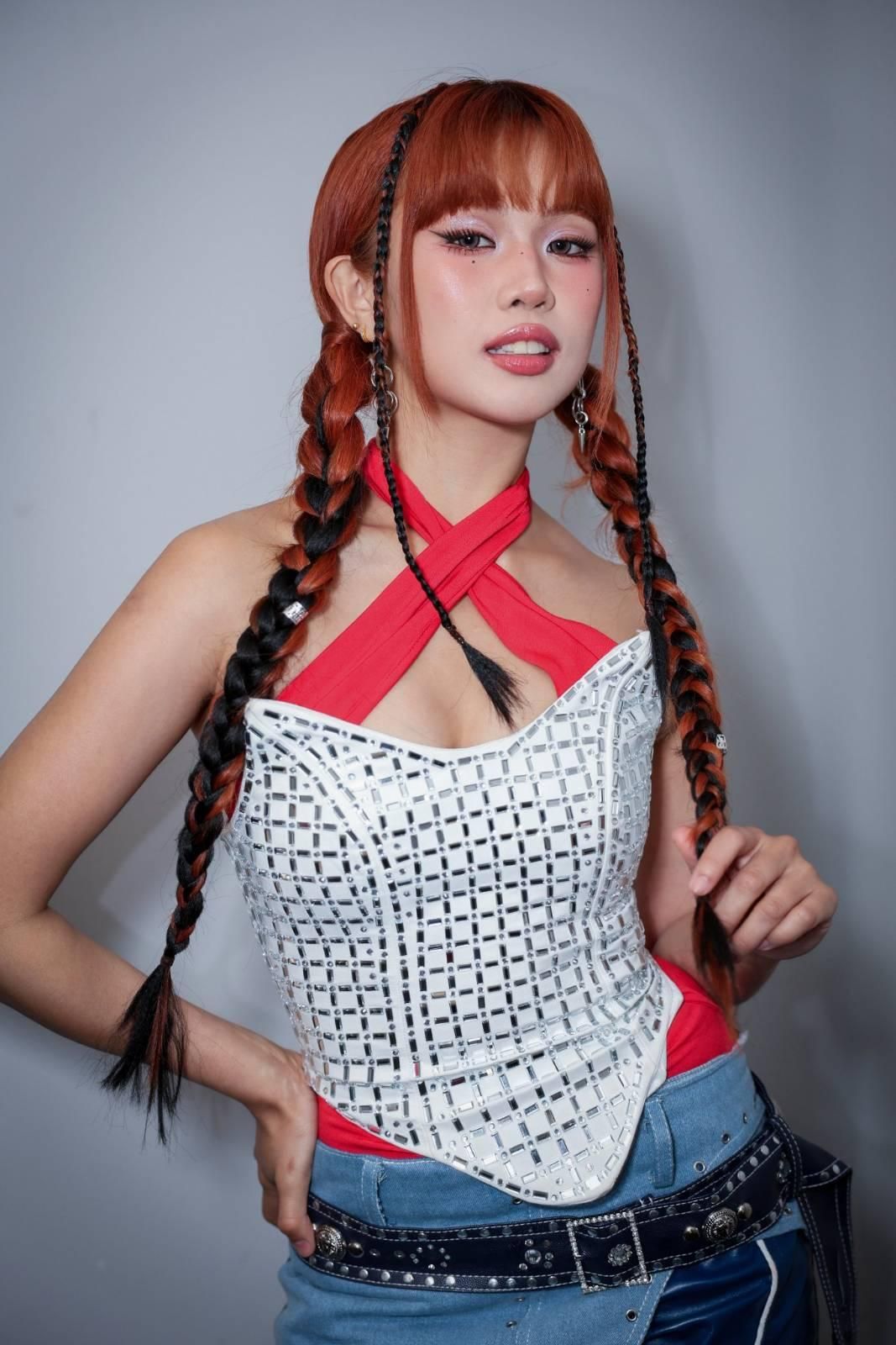 Bini's Maloi Ricalde, wearing a white blouse.