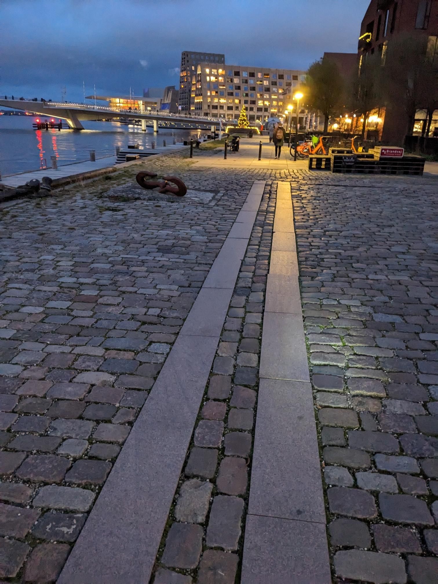 Smooth paving strips in the middle of cobblestones.