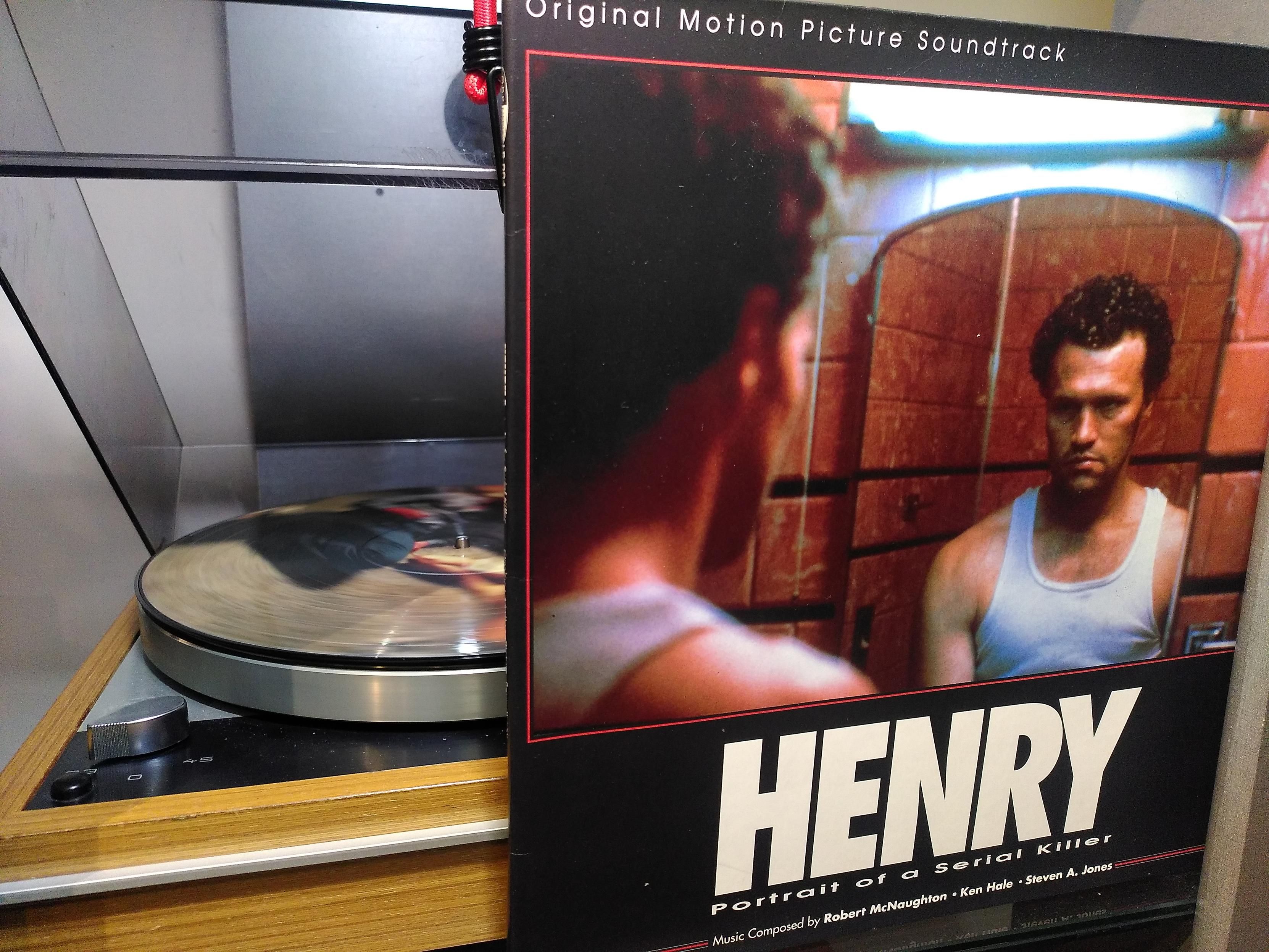 Cover of Henry Portrait of a Serial Killer soundtrack LP. The title character stares at himself in a mirror