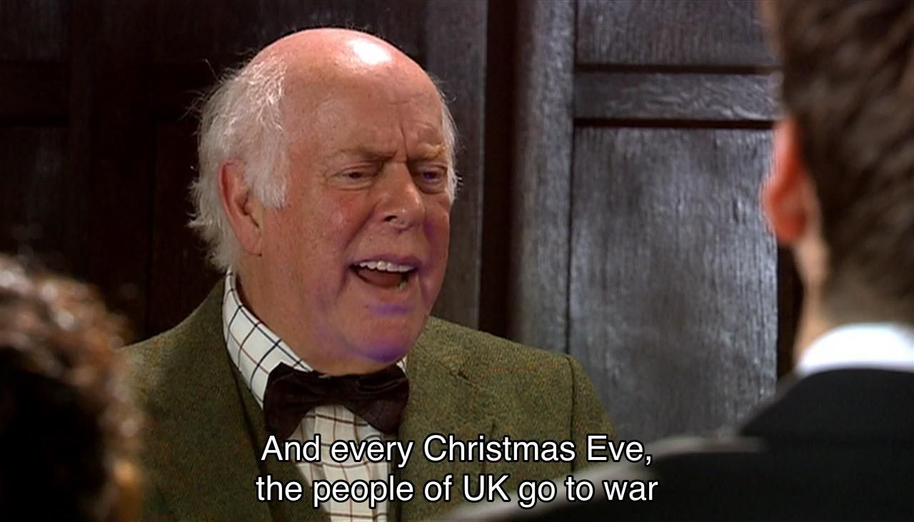 David Tennant episode. (Aren’t they all?) We’re in a really nice ballroom on a spaceship replica of the Titanic in the far future. A bunch of people are crowded around an old man listening to him speak, including the Doctor, looking a bit perplexed at what he’s saying. Captions read, “And every Christmas Eve, the people of UK go to war with the country of Turkey.”