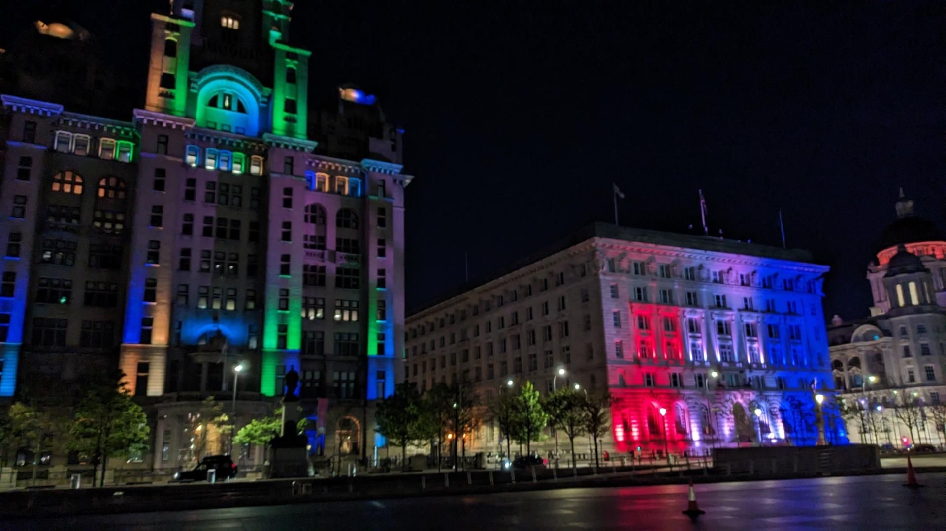 Colorful illuminated buidlings on the waterfront at night