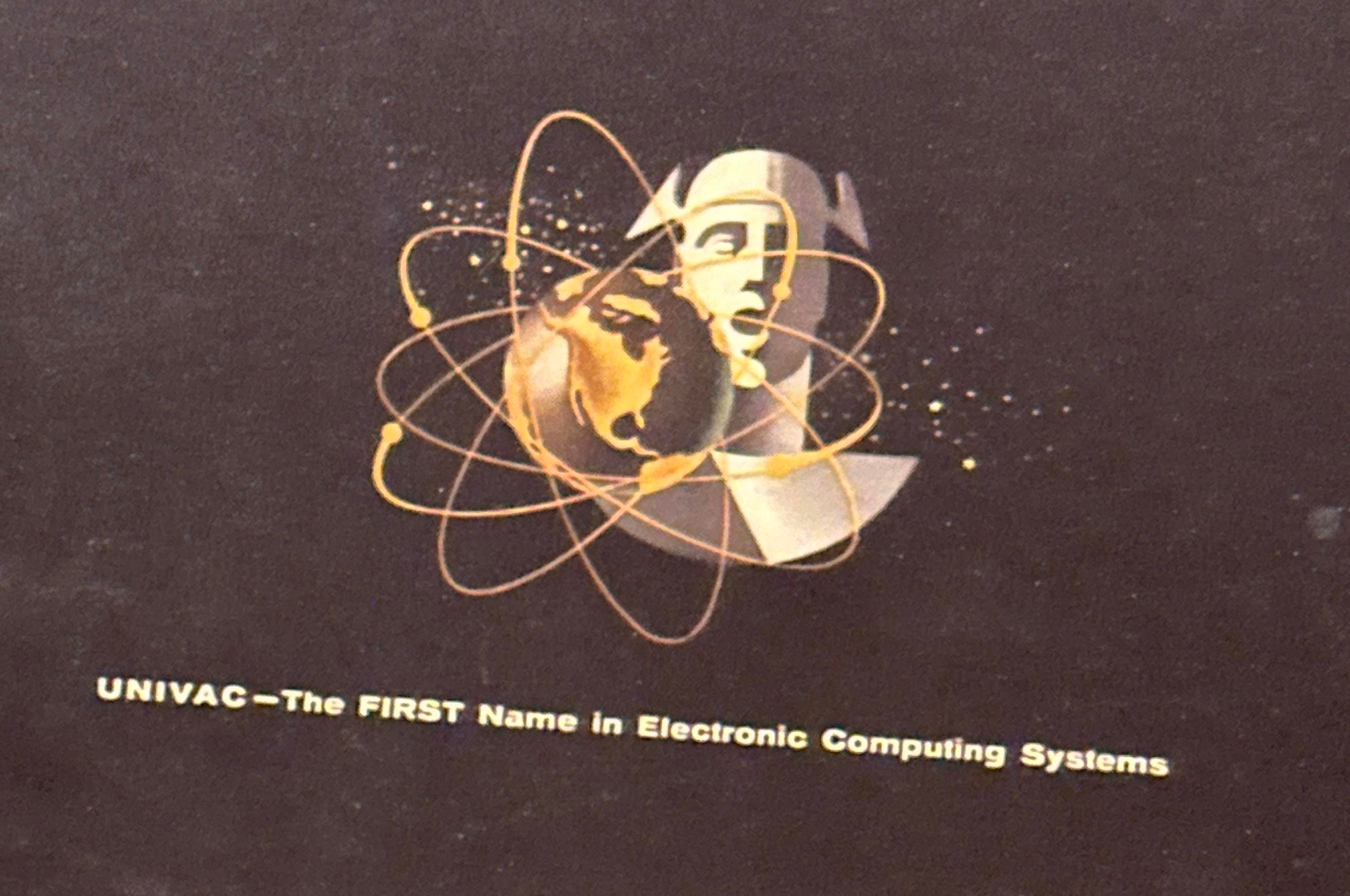 A univac logo with like an atom earth and screaming man 