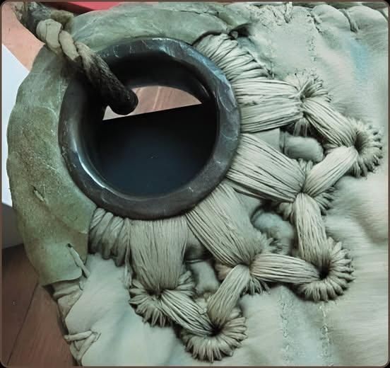 This is the corner of a hand-sewn sail made in the 1800s.