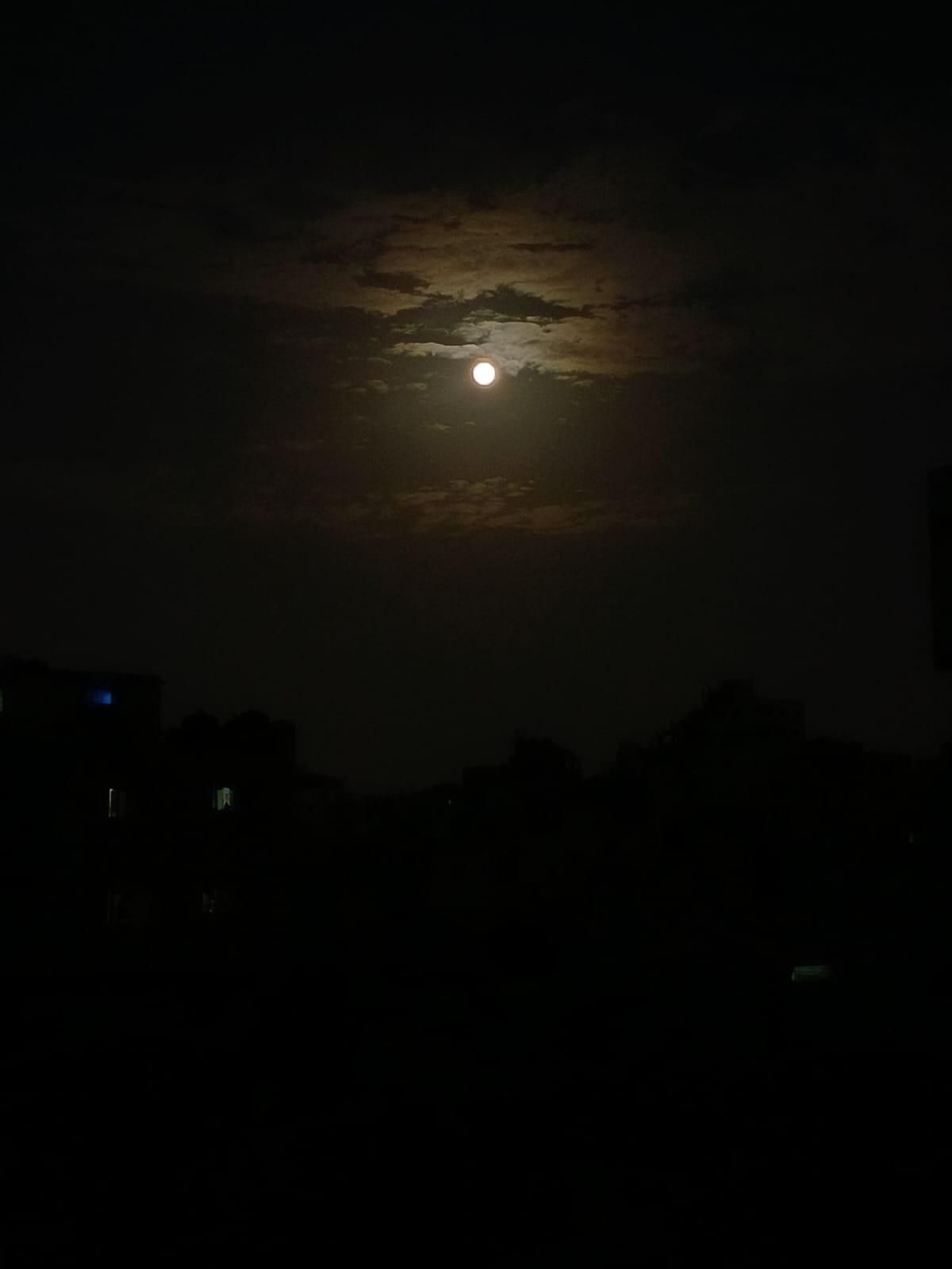 The moon in the sky last night, photographed from the roof of the school where my family is sheltering in Khan Yunis.