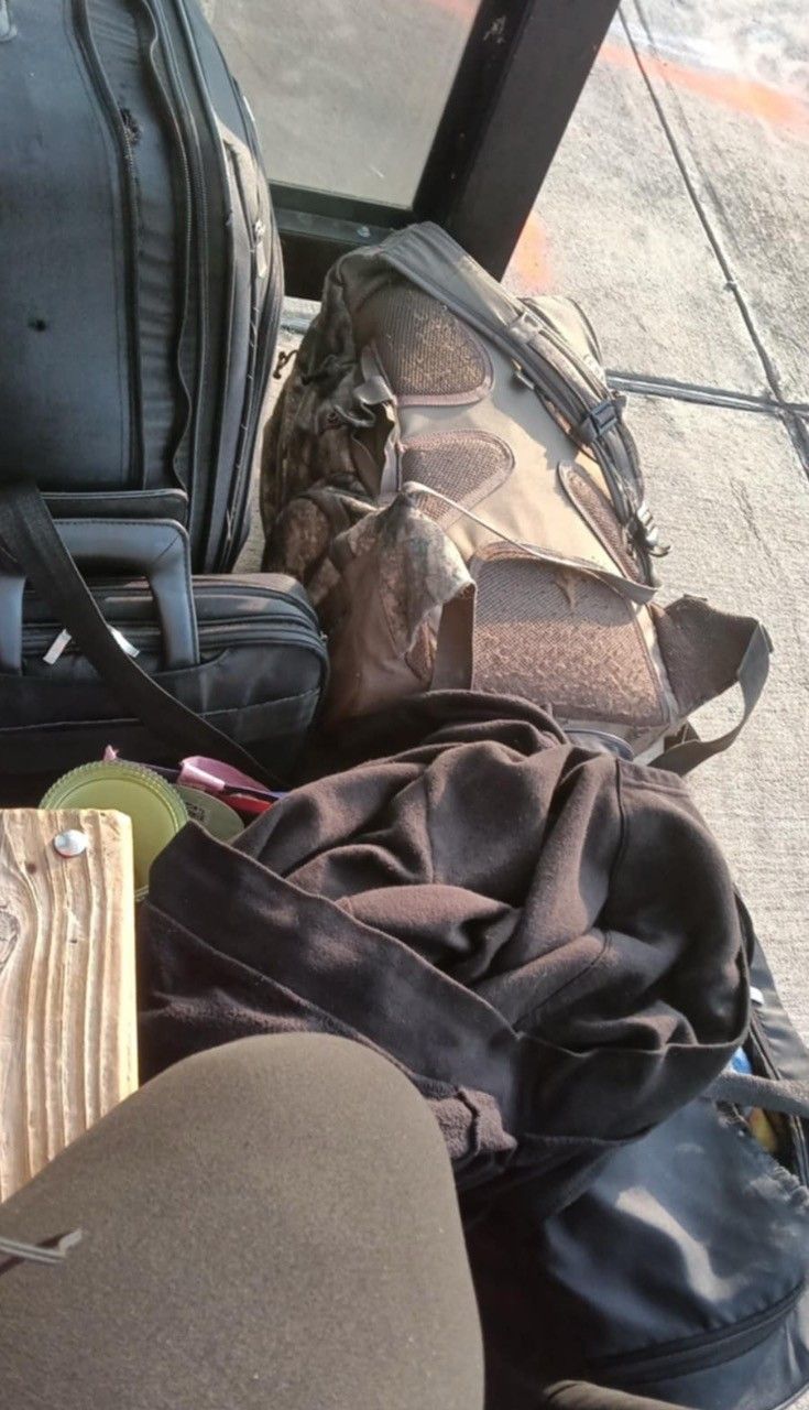 Photo Peach sent me and gave me permission to post. She is sitting on a bench with all her belongings in bags.