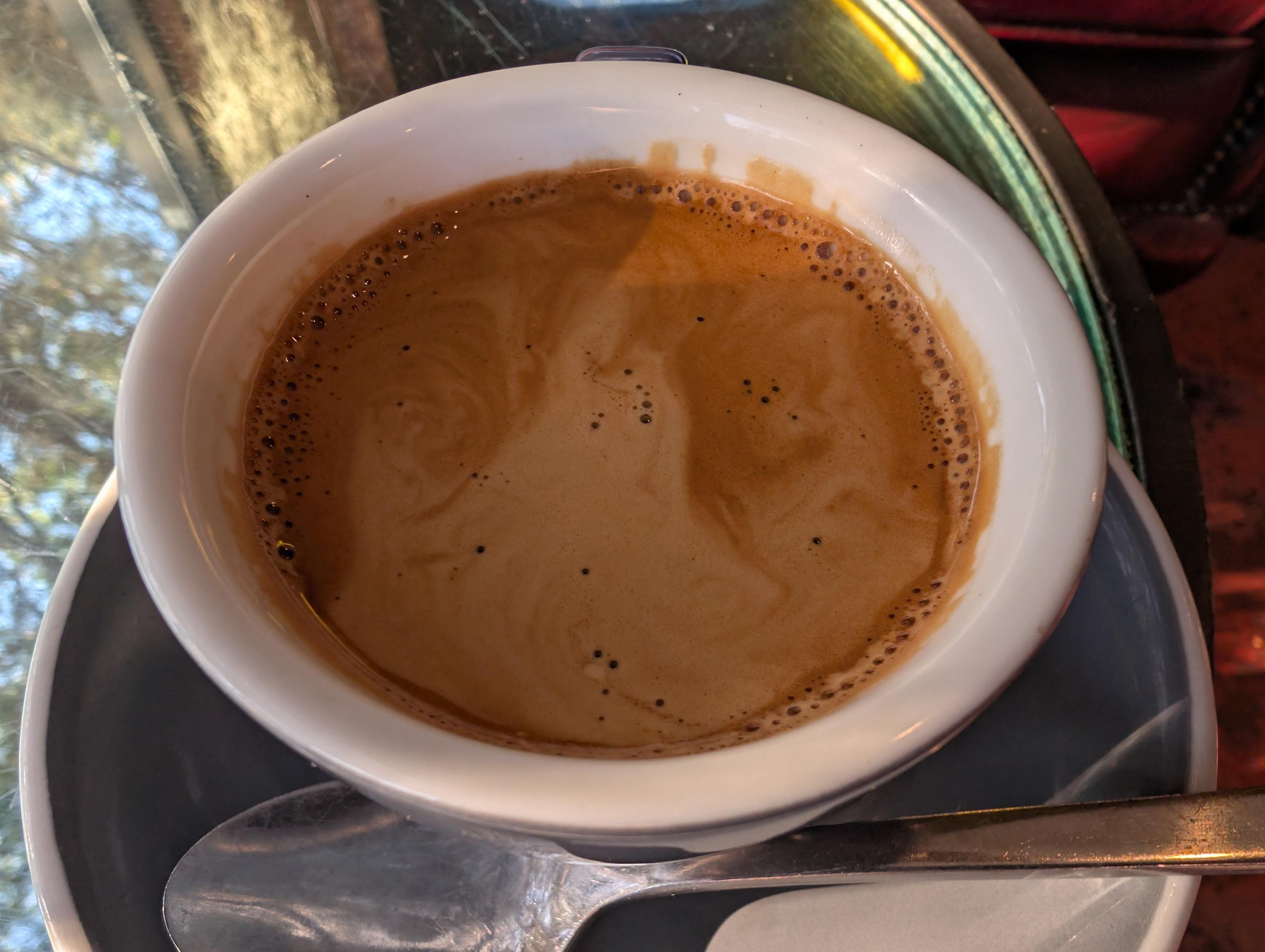 Coffee crema 

I see a ghost with swirls for hands may be fire hands