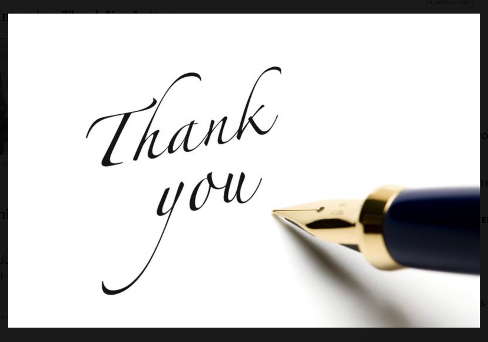 A handwritten, thank you, and what looks like the ink pen that wrote it poised to write more.