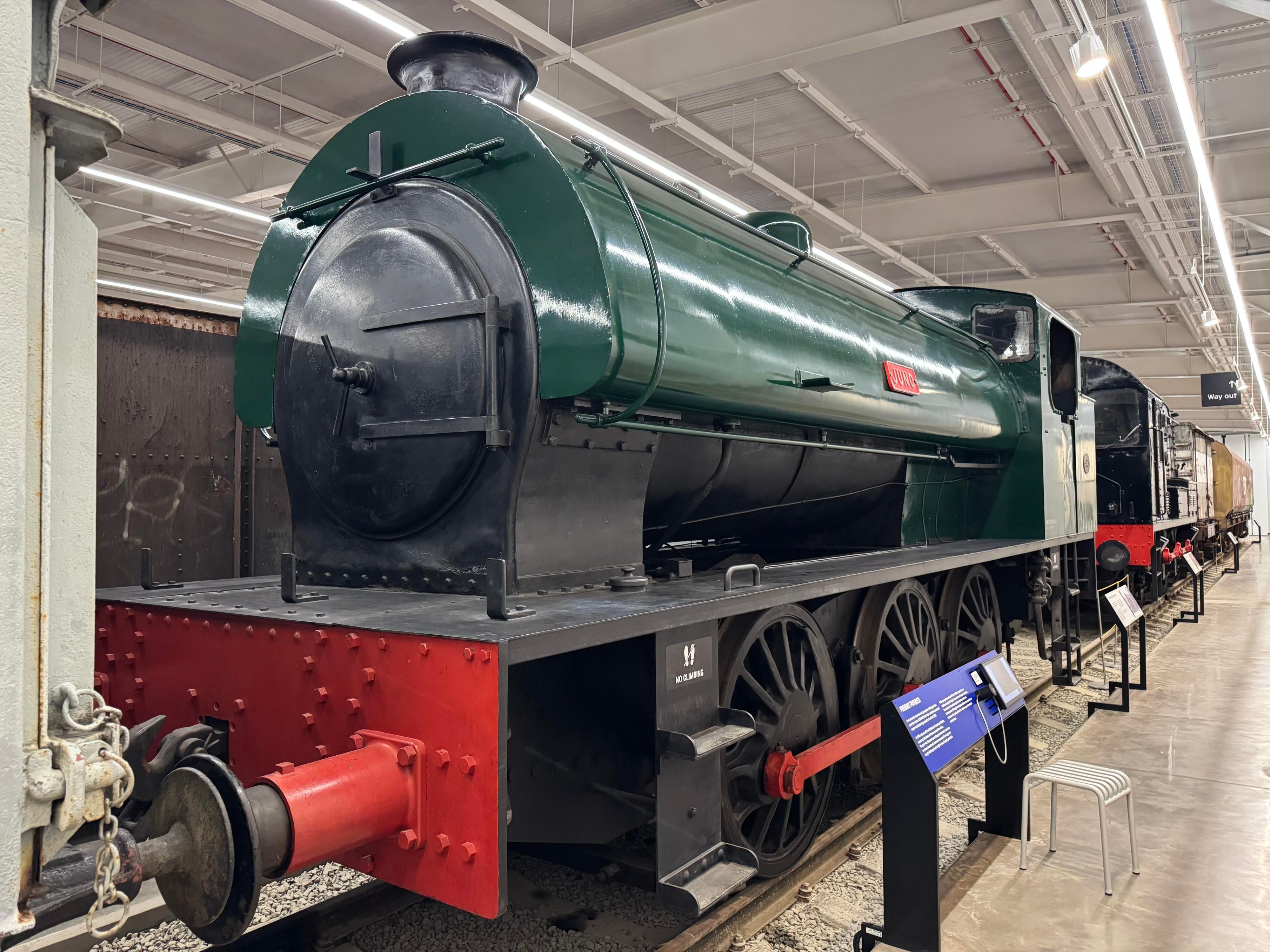 A very basic-looking green-painted steam locomotive called Juno