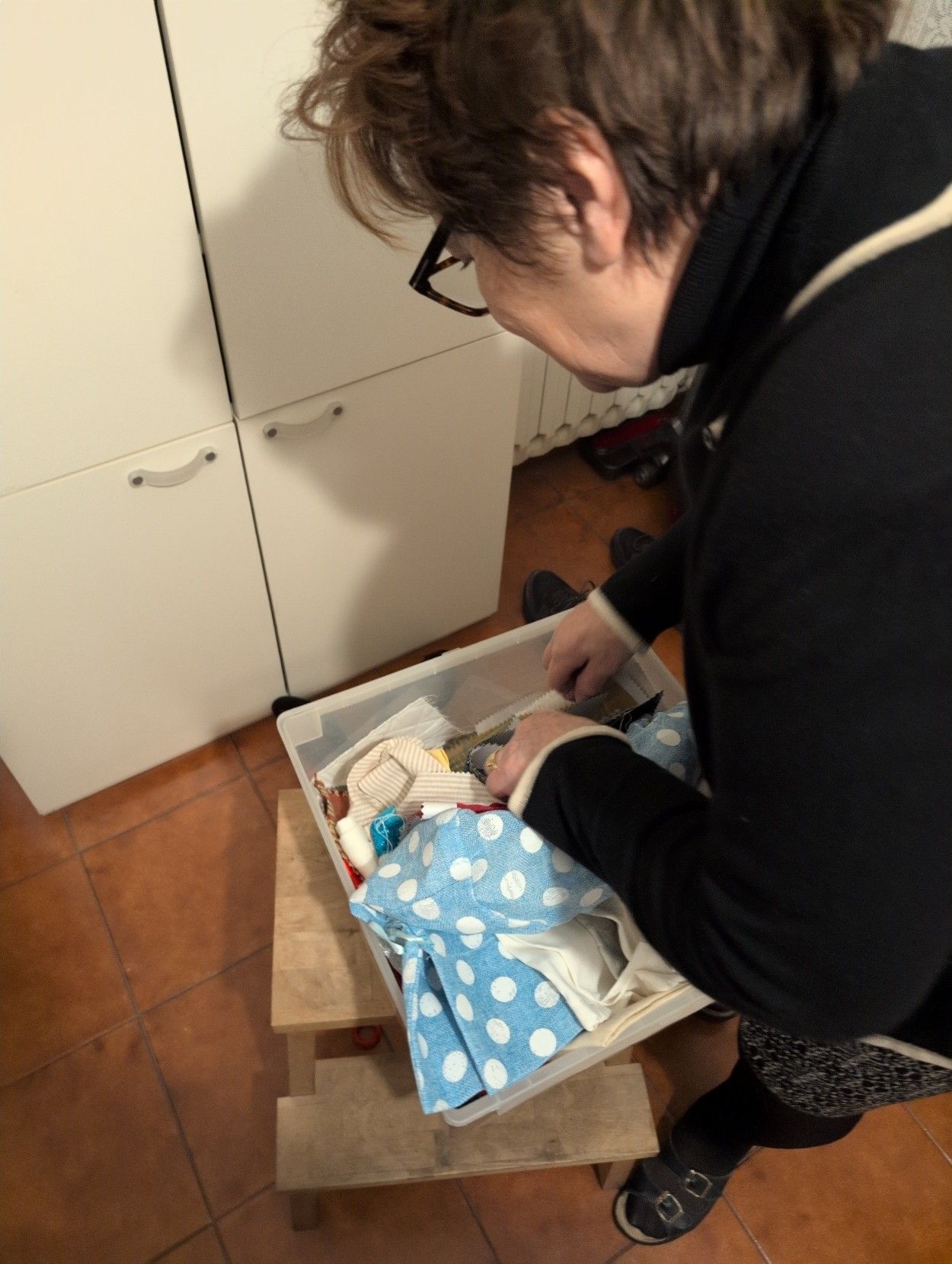 Nonna Gorix while looking for fabric pieces.