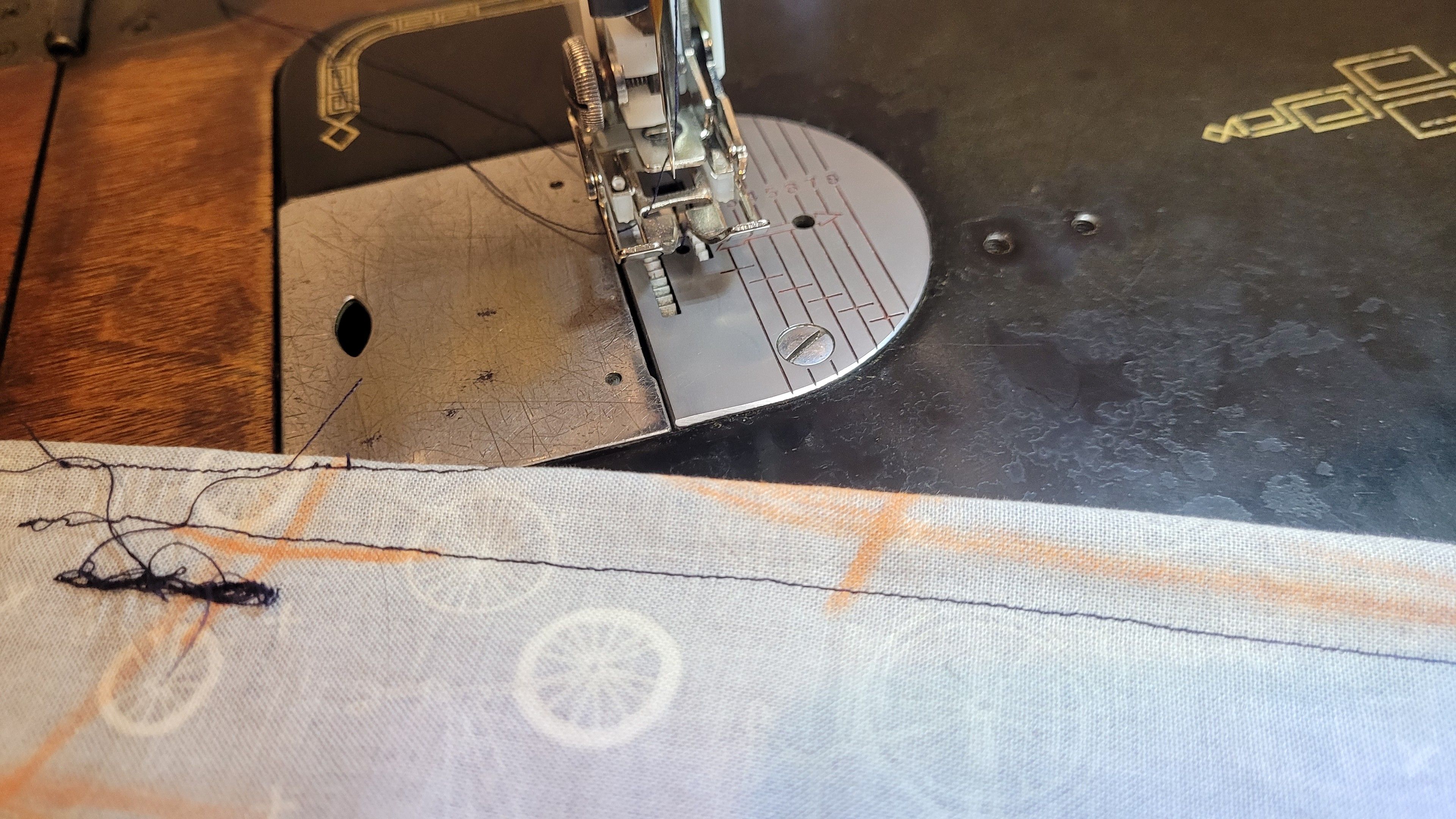 Test stitches on fabric with crayon markings