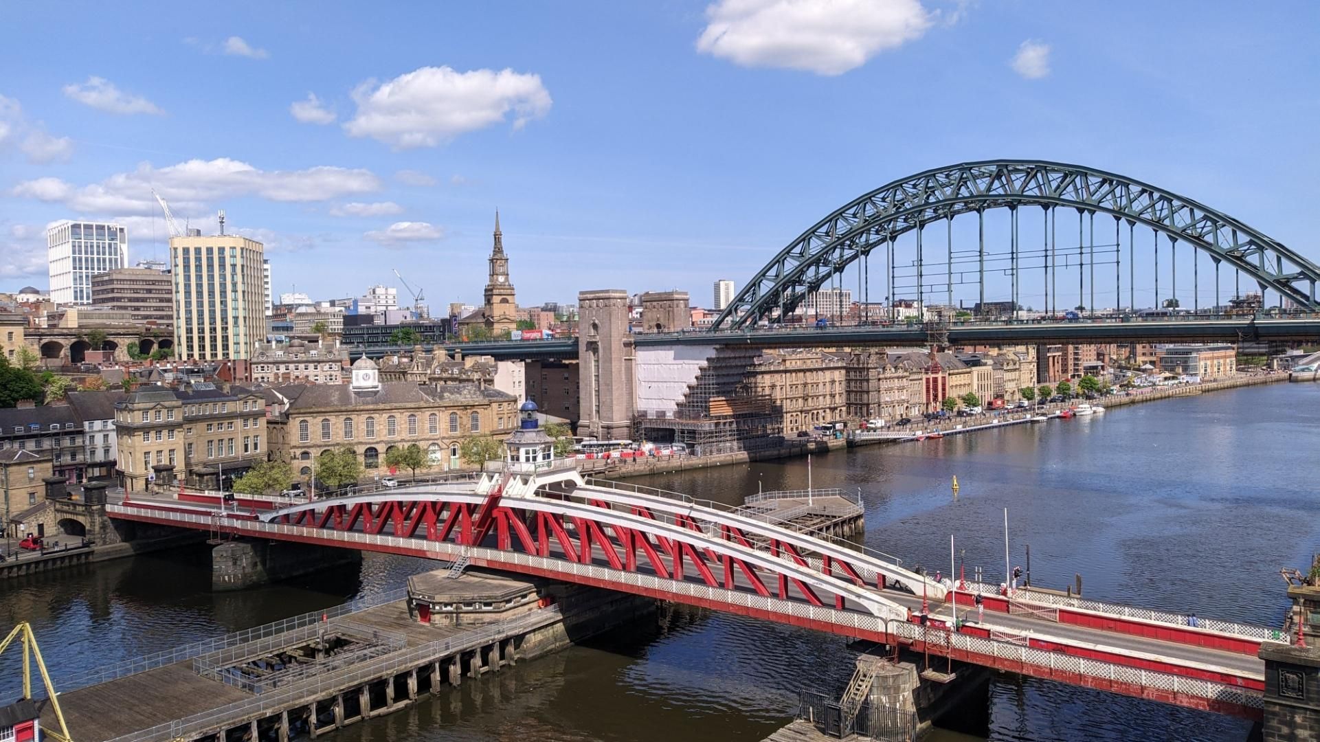 A swing bridge below, and a high up one arch steel bridge behind over the Rover Thyne