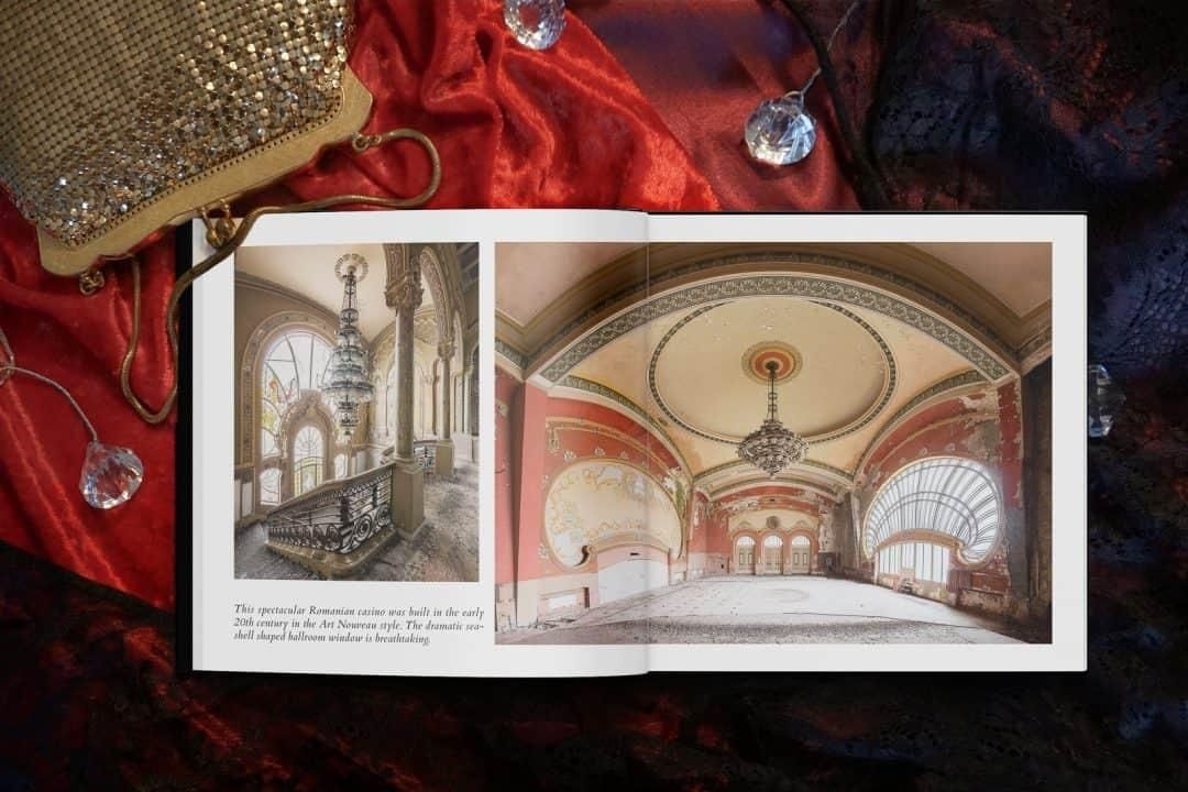 open book with photo of red abandoned ballroom