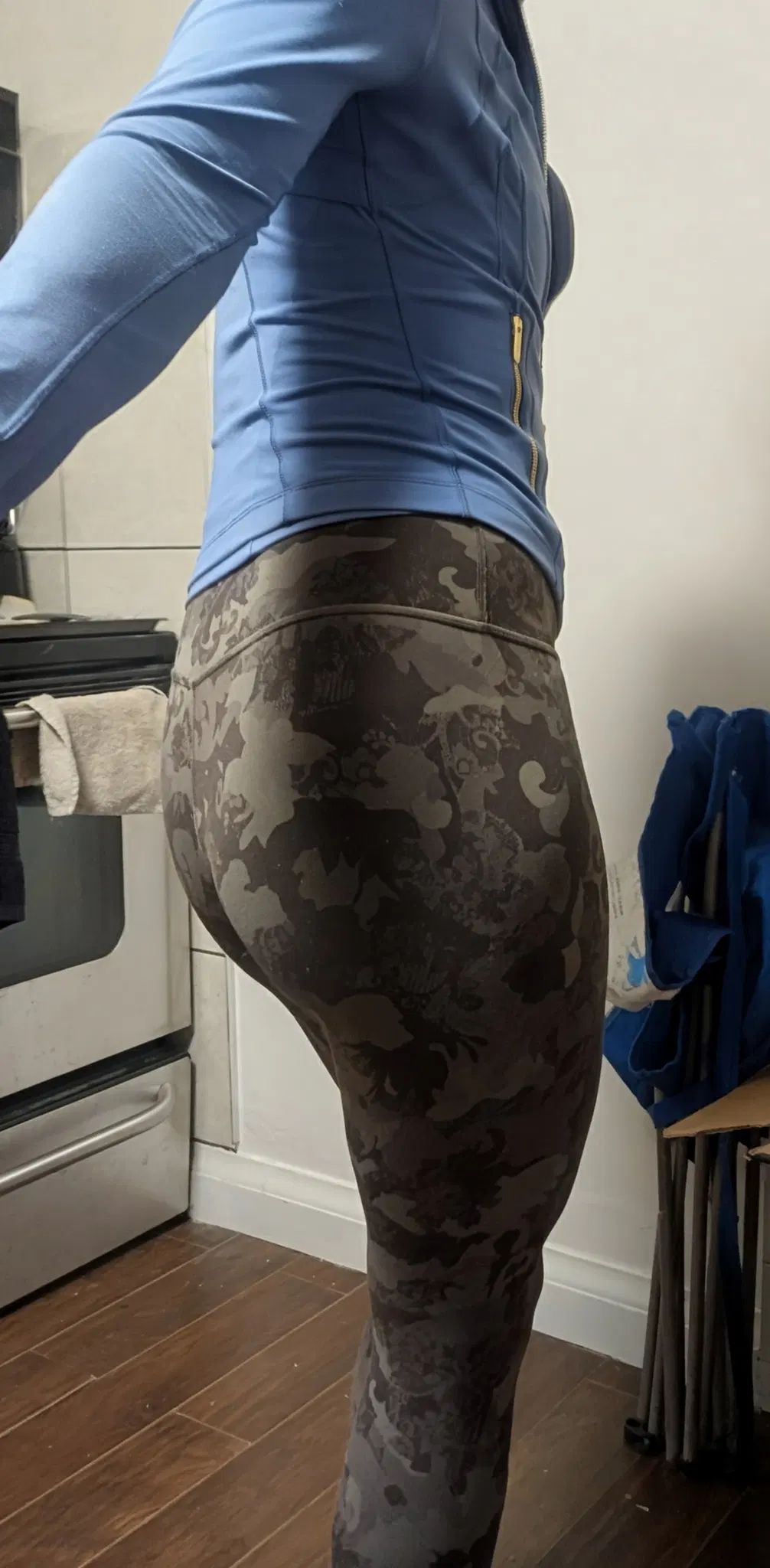 Same outfit as the first pic. The zipper is done up half way, but primarily the tight fitting leggings show off my little round bum. 