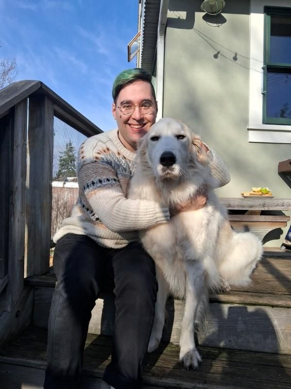 Me hugging a big white fluffy doggy. I look very cozy and also attractive, I have green hair.