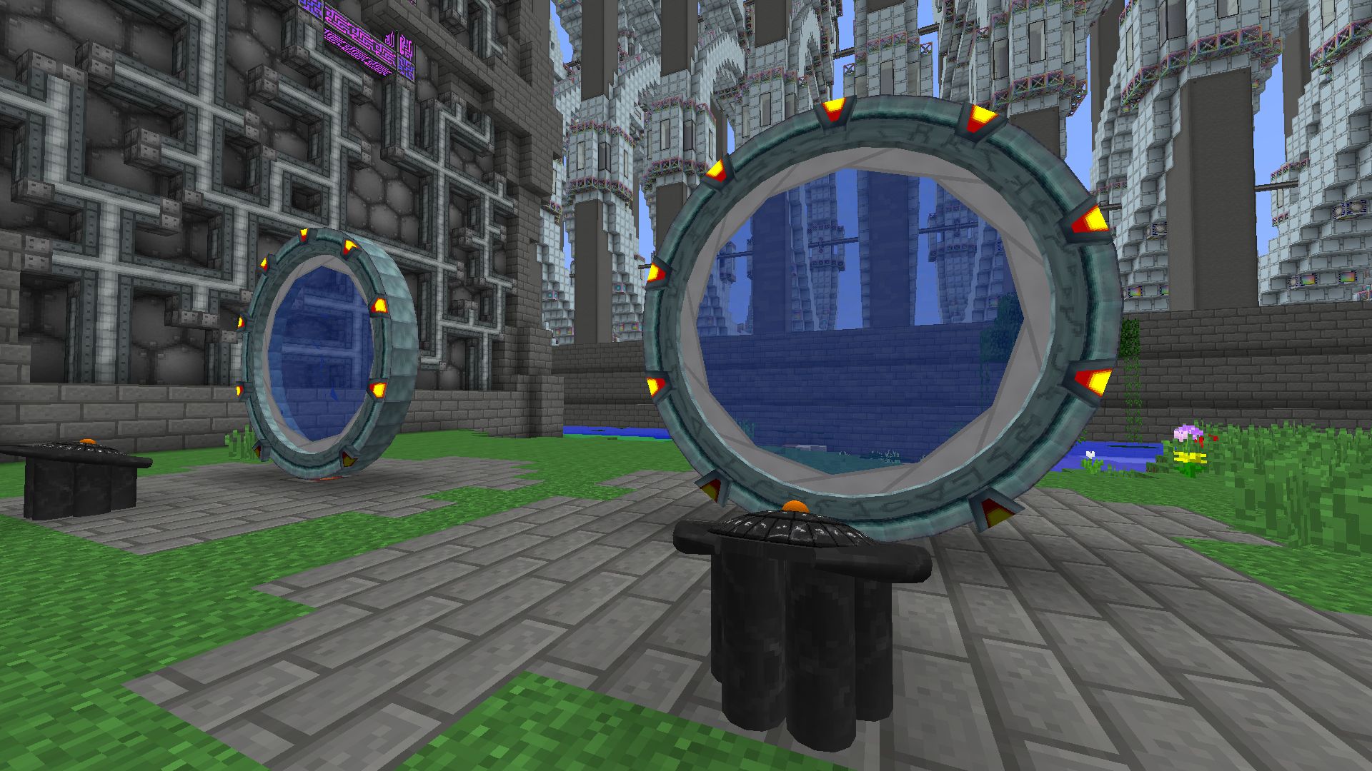 Modded minecraft screenshot:

A pair of open stargates on some  grass in front of some large machines