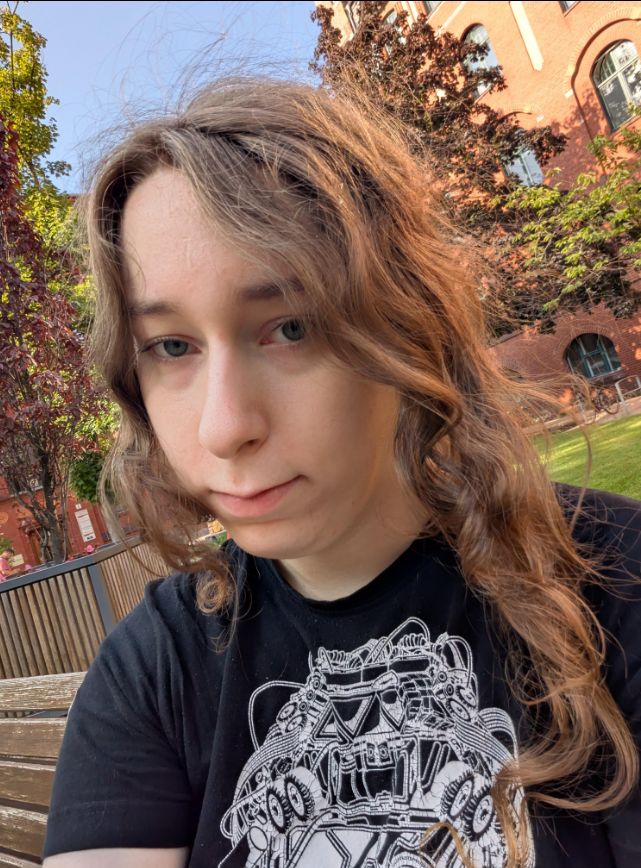 alina in a very pretty garden, with soft and beautiful hair and skin. she's a bit sad, but hopes for the best