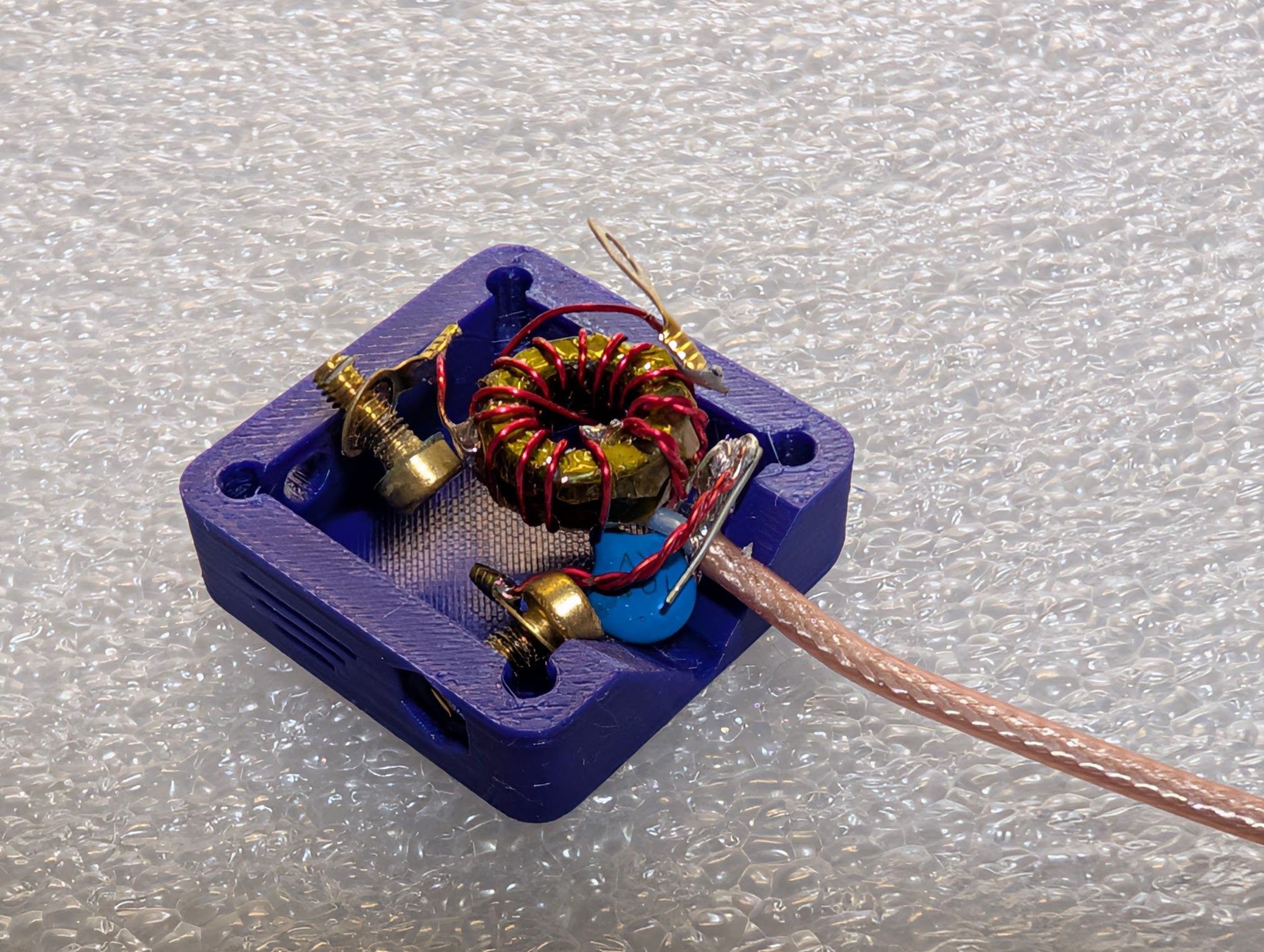 The electronic parts loosely placed next to the box in which they will be installed