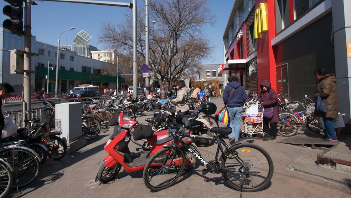 bikes on bikes locked in front of a mcdonalds