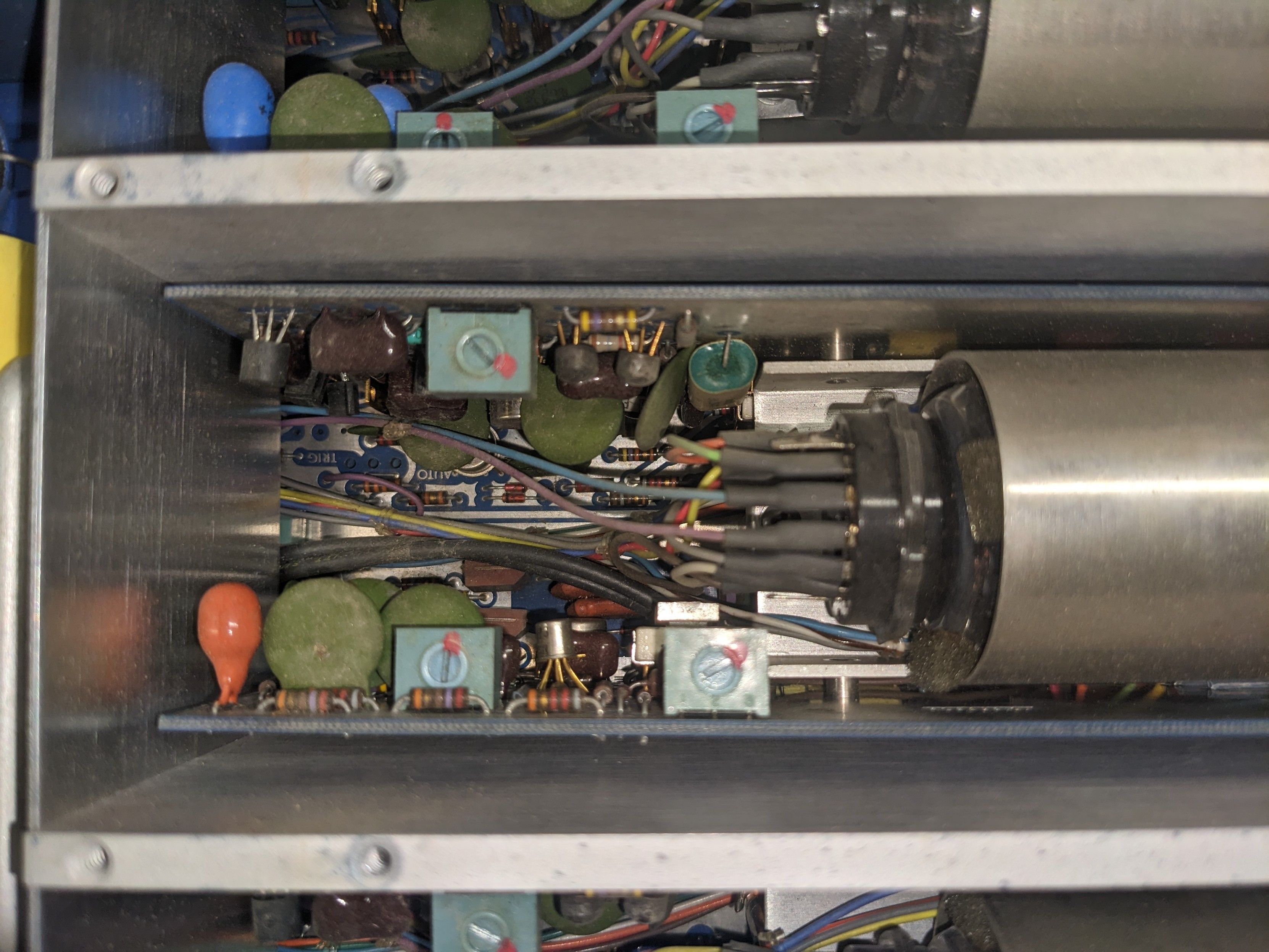 Close up.photo of one pair of pcbs showing 3 trim pots and many, tiny through-hole components