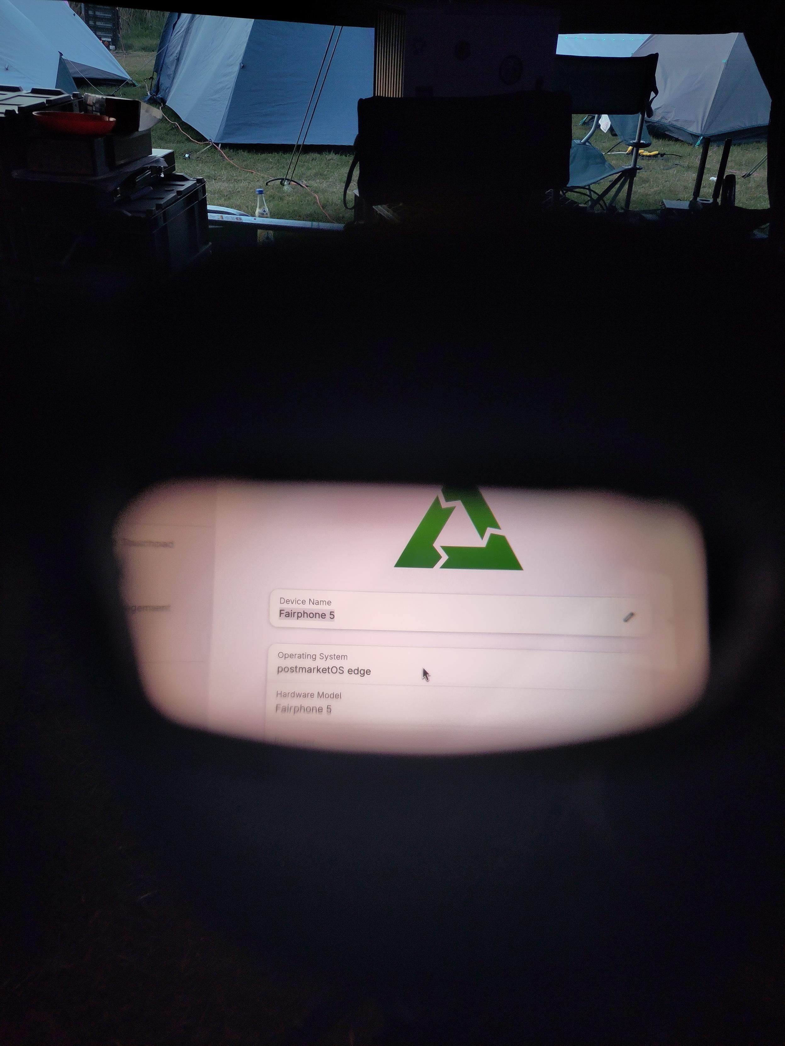 GNOME Settings, showing postmarketOS and Fairphone 5 on one of the sides of the glasses