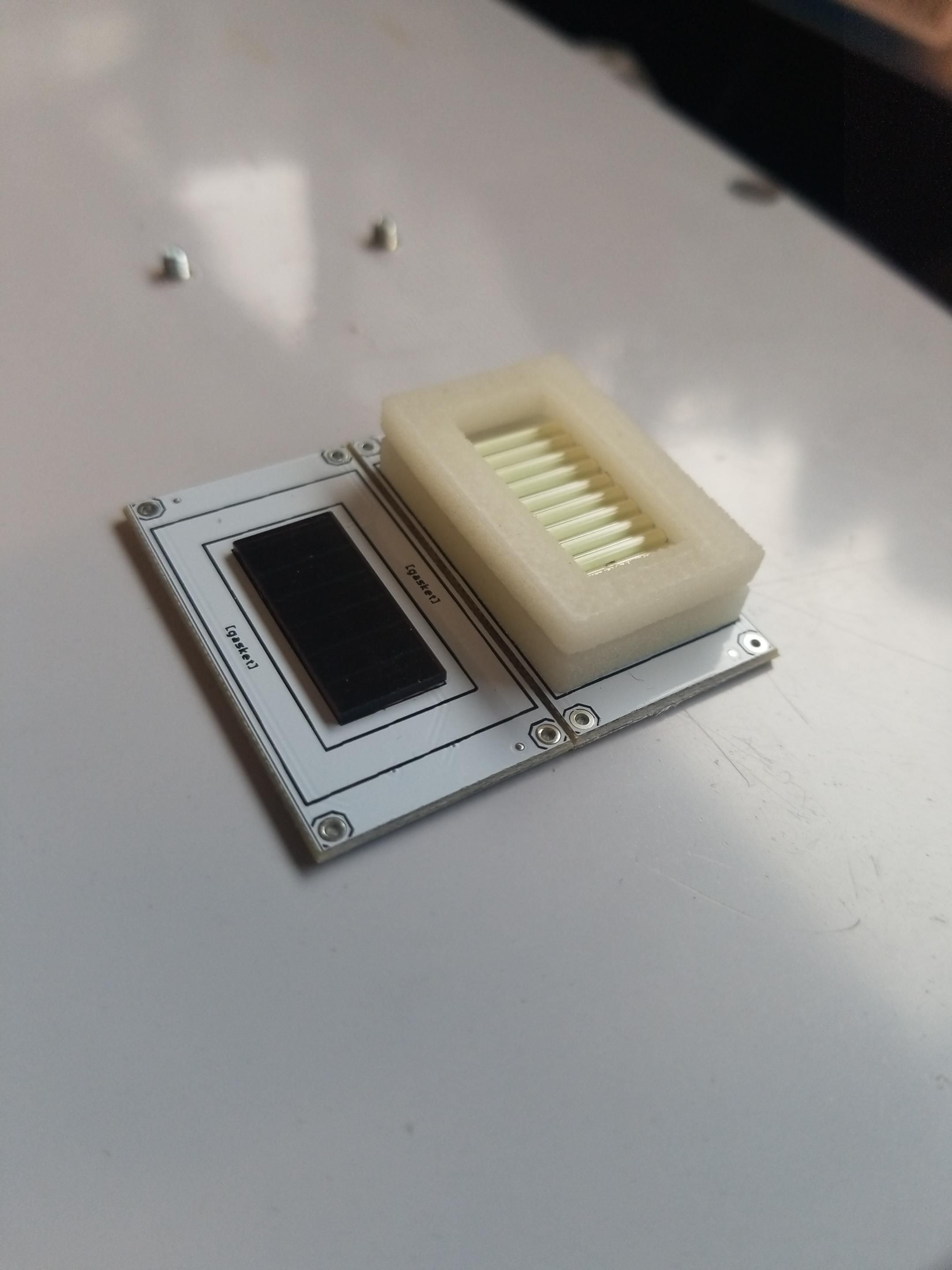 Underside of the PCB, showing a small photoelectric cell