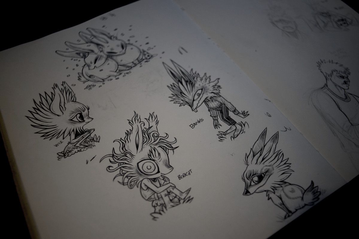 a photo of a sketchbook page showing several drawings of humanoid rabbits, as well as a creature that is kind of a wolf(a wox, Ive heard)