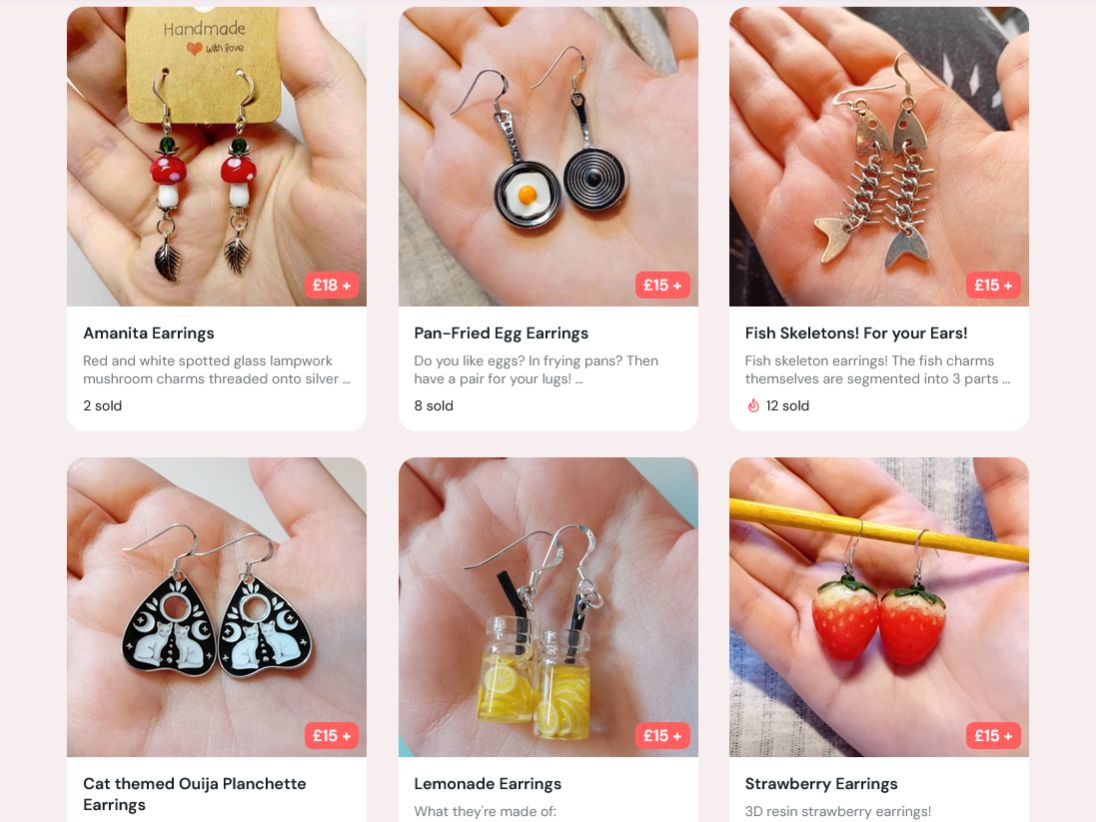 6 picture listings of fish-hook earrings with themes ranging from Mushrooms, fried eggs in pans, fish skeletons, cat themed mini Ouija planchettes, tiny jars of lemonade, and strawberries.