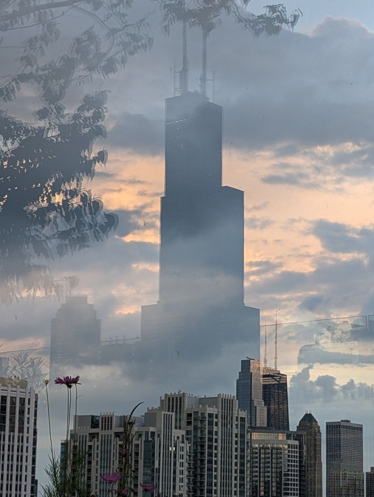 A reflection of the Willis Tower with the Hancock in the distance