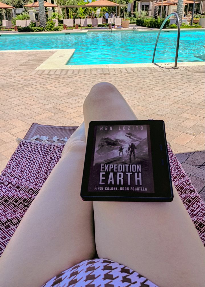 Eva's afternoon at the pool, partially reading "Expedition Earth", but mostly falling asleep with the warm sun 🌞. 

Yes, that is a brown houndstooth swimsuit, and oh lordy what happened to my muscles... gotta start riding again.