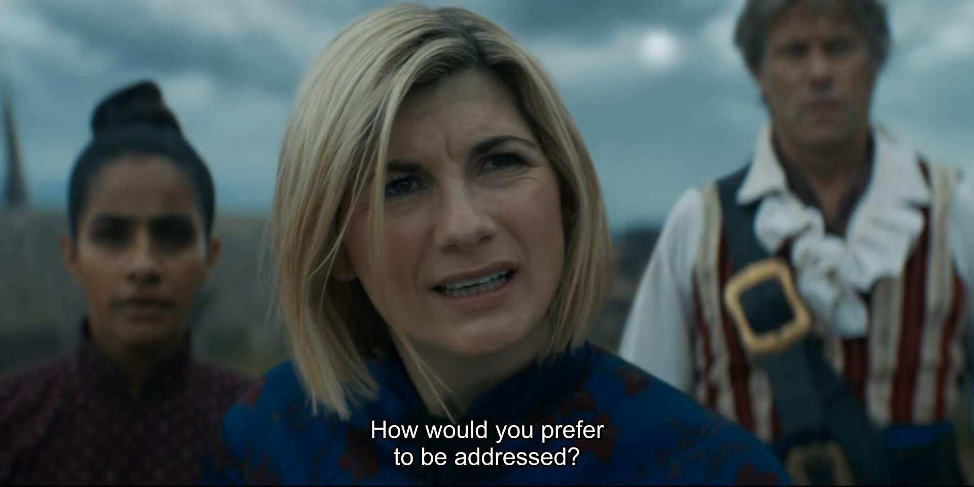 Jodie Whittaker episode. The Doctor is standing in a gray cloudy beachside town with Yaz and Dan, inexplicably dressed up in ridiculous pirate-esque garb, behind her. Don’t worry, they’re not saying anything, as if they’ve forgotten to give them any dialogue in this scene. The Doctor asks, “How would you prefer to be addressed?” A Sea Devil (this episode takes place before that term was canonically decided to no longer be in vogue) replies, “Where is it?” The Doctor does a proper Jodie scronchy face and says, “Mr. WherelsIt? Lord WherelsIt?”