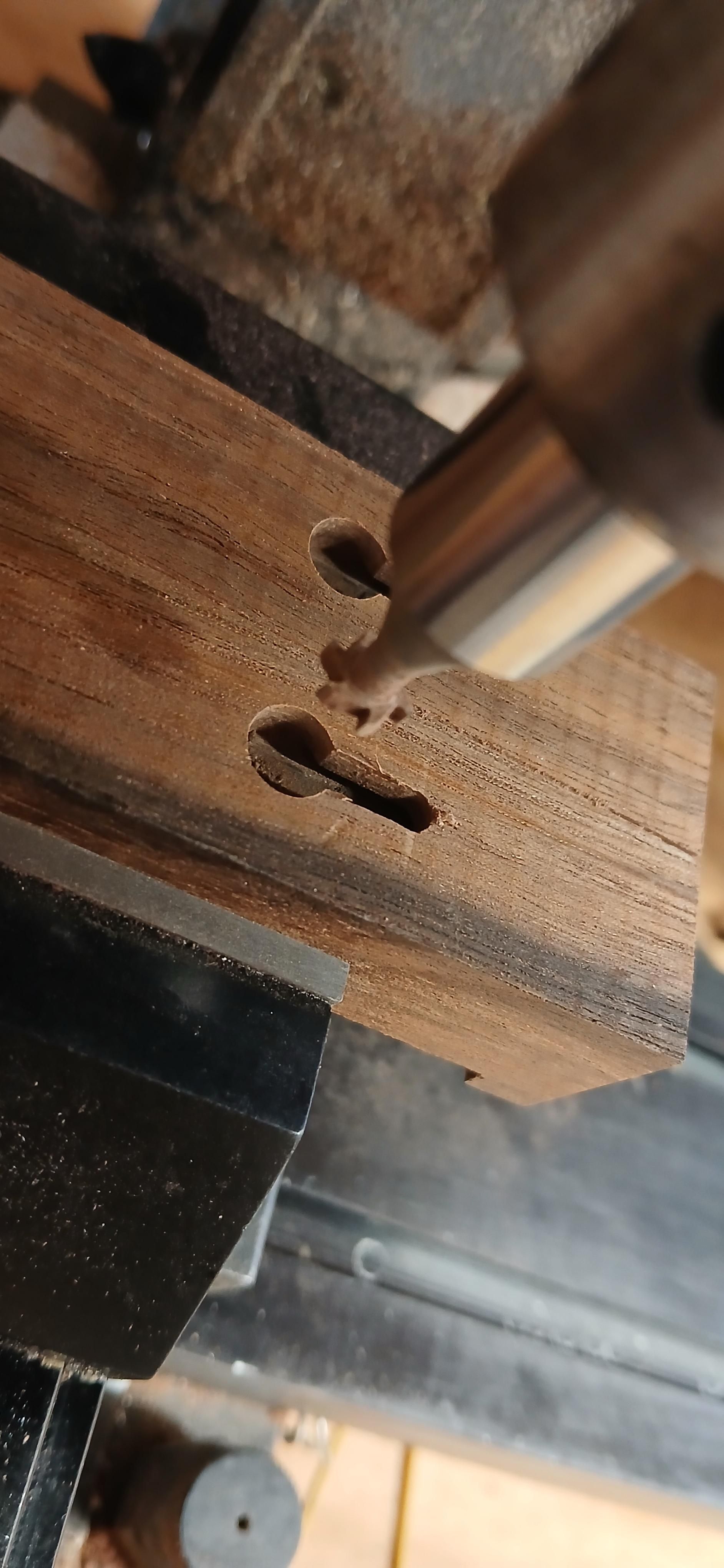 Twin keyhole slots cut in walnut with a t slot cutter in the mill spindle